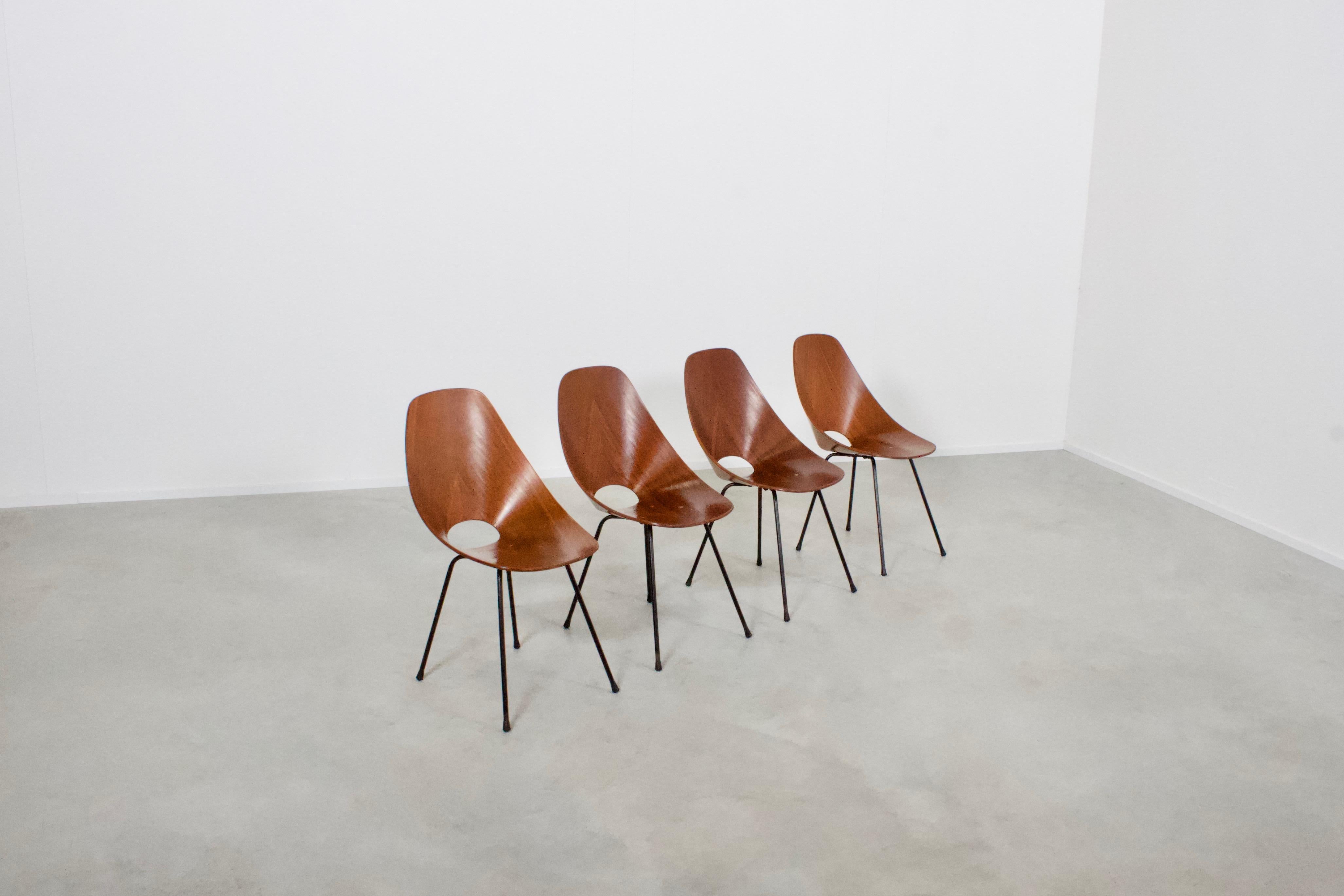 Set of four original ‘Medea’ chairs in very good condition.

Designed by Vittorio Nobili, Italy 1955

Produced by Tagliabue 

The plywood shells are veneered in mahogany with a beautiful grain, they are formed out of a single piece of thermo-formed