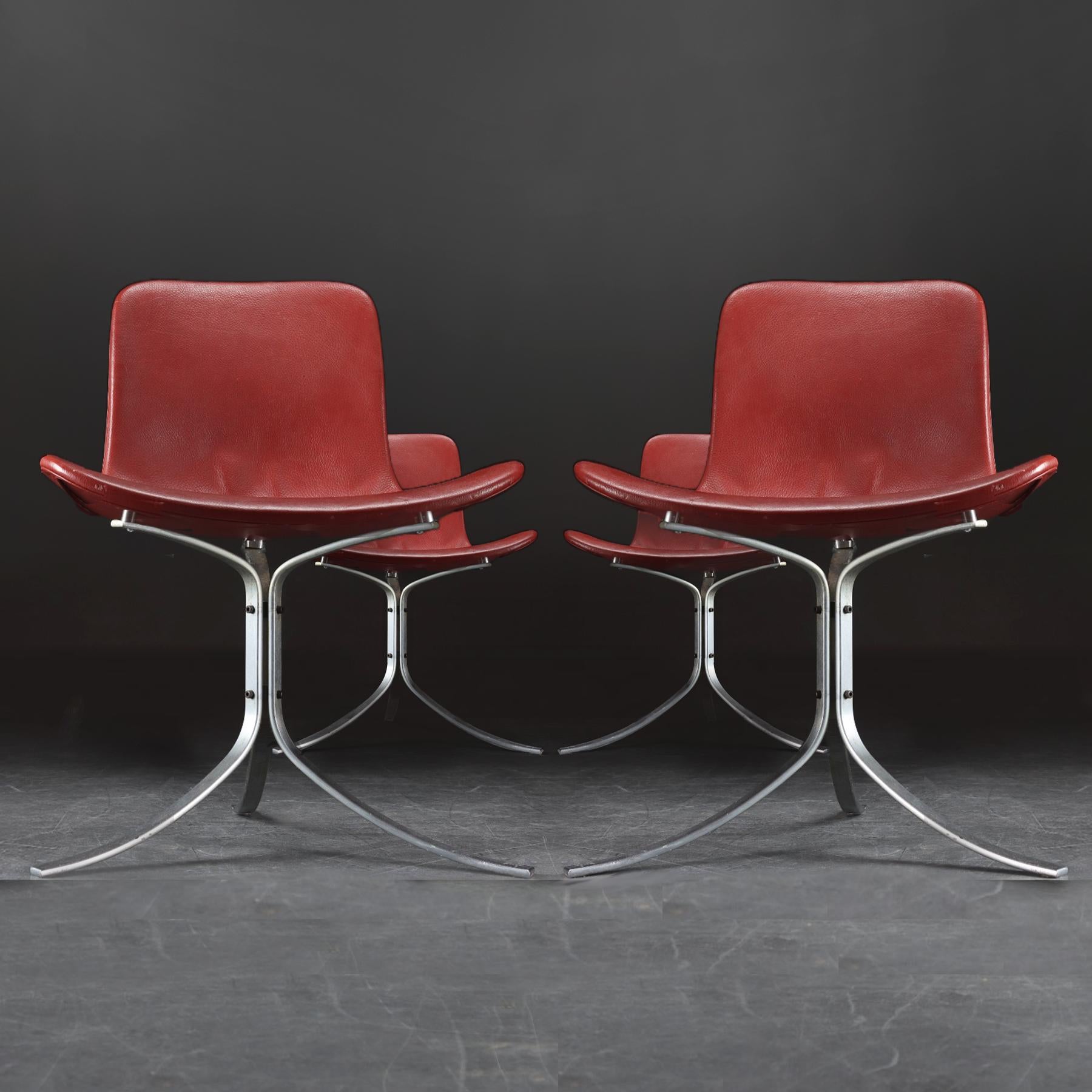 A set of 4 Danish Mid Century vintage leather and steel PK9 chairs designed by Poul Kjaerholm for E. Kold Christensen with additional bespoke optional seat height extensions.

These are a beautifully crafted set of chairs with a simple but striking