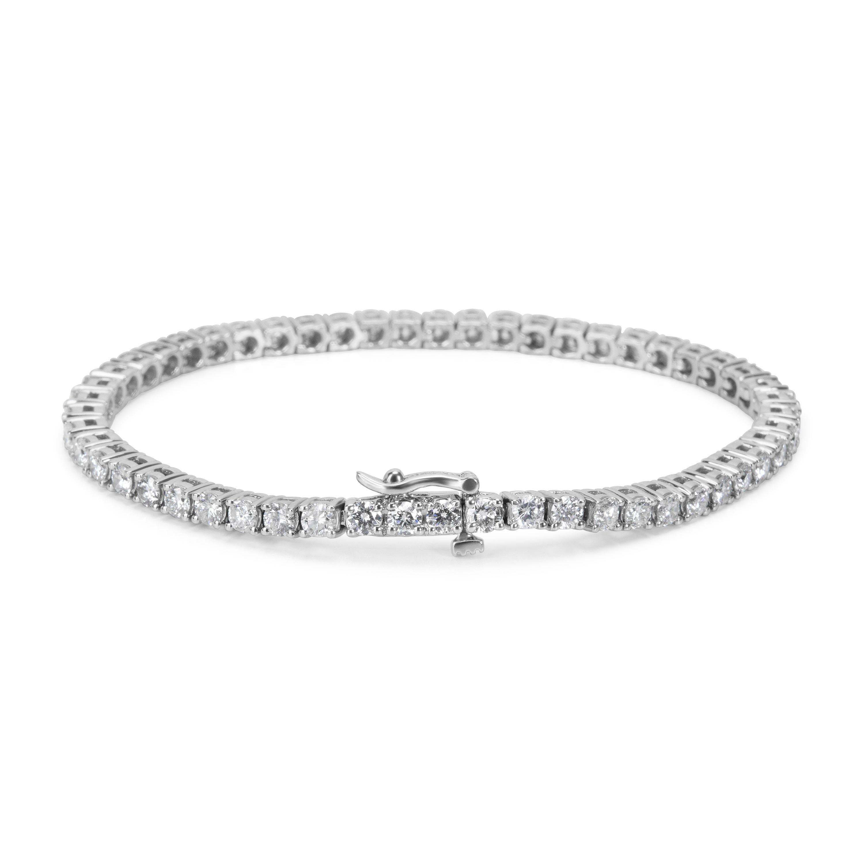 Brand New & unworn.  Bracelet length is 6.75 inches. There are 56 diamonds totaling 4.36 carats set in 14K white gold.

Stone Type: Diamond
# of Diamonds: 56
Stone Weight: 4.36 ctw
Stone Color: G-H
Stone Clarity: SI1-SI2
