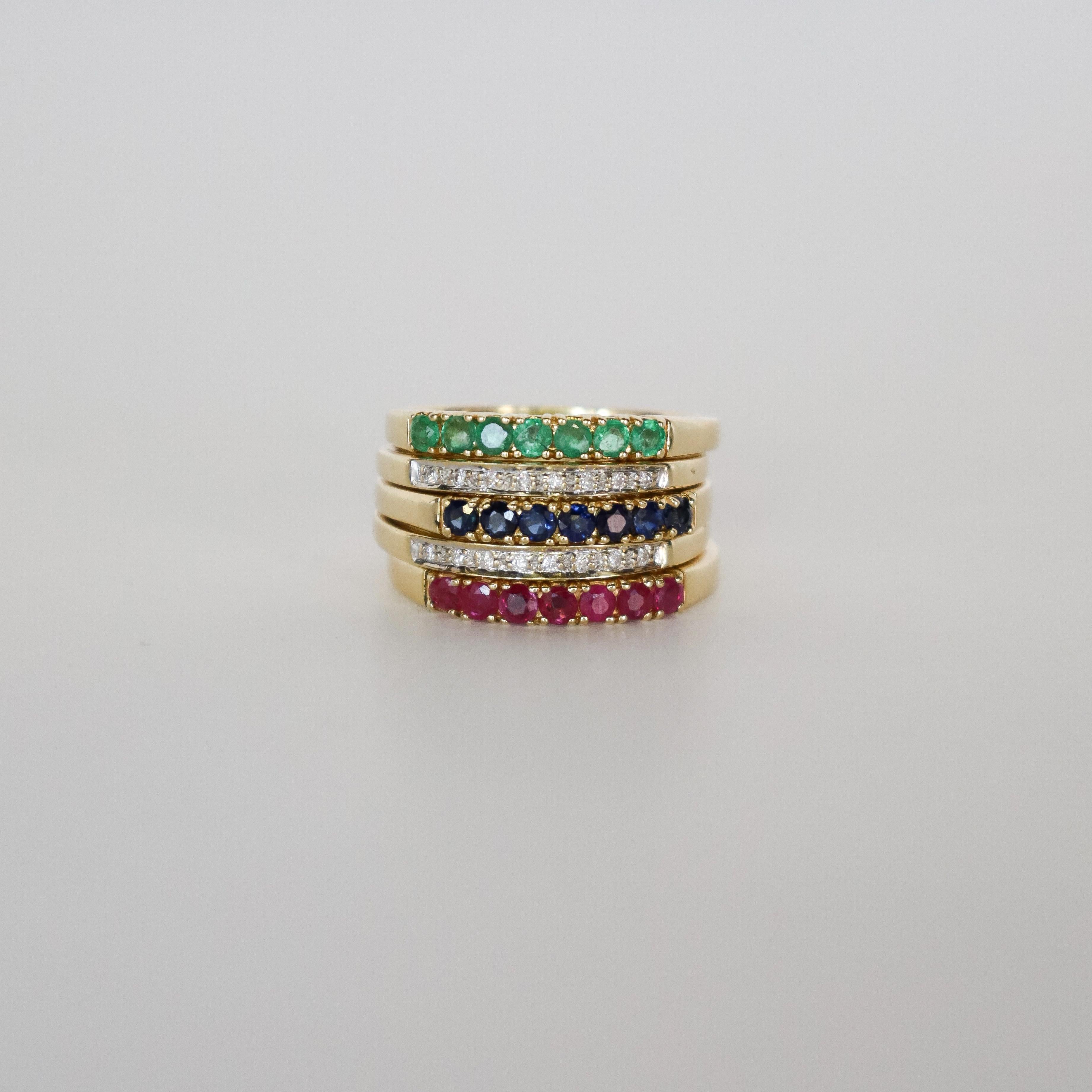 Discover the elegance and versatility of this 18k gold half eternity ring set, featuring 1.6 ct VVSI diamonds, natural rubies, sapphires, and emeralds. This exclusive vintage European piece includes four interchangeable band rings, each adorned with
