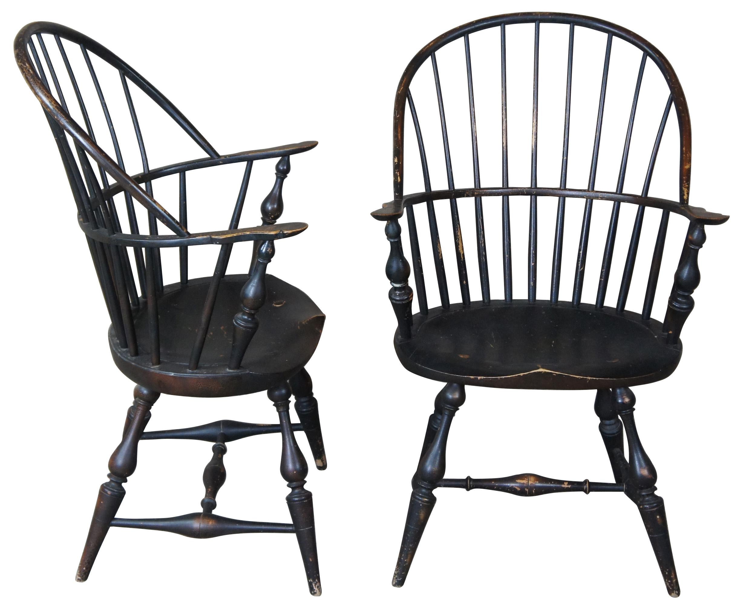 Late 20th century bow back Windsor armchairs by River Bend Chair Co. Features a black crackle finish with vase shaped legs.
  