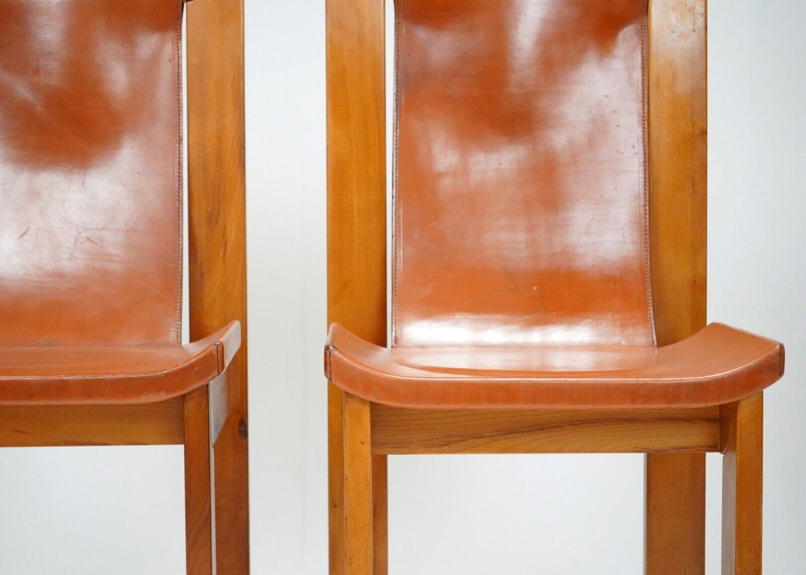 Set of four solid elm chairs with sling back cognac leather seats designed by Roland Hauesler for Maison Regain.
Made in France in the 1980s these Brutalist chairs are elegant, comfortable and superbly designed.
Sourced in France.
The condition