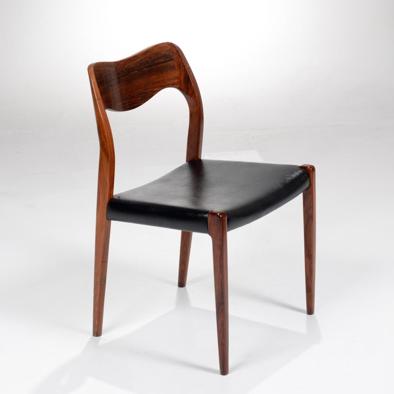 4 rosewood dining chairs designed by Niels Otto Møller for J. L. Møllers Møbelfabrik. The model 71 dates to 1968 and is an exceptional chair offering a very comfortable posture and the warm modern look typical of great Danish design. Many upholstery