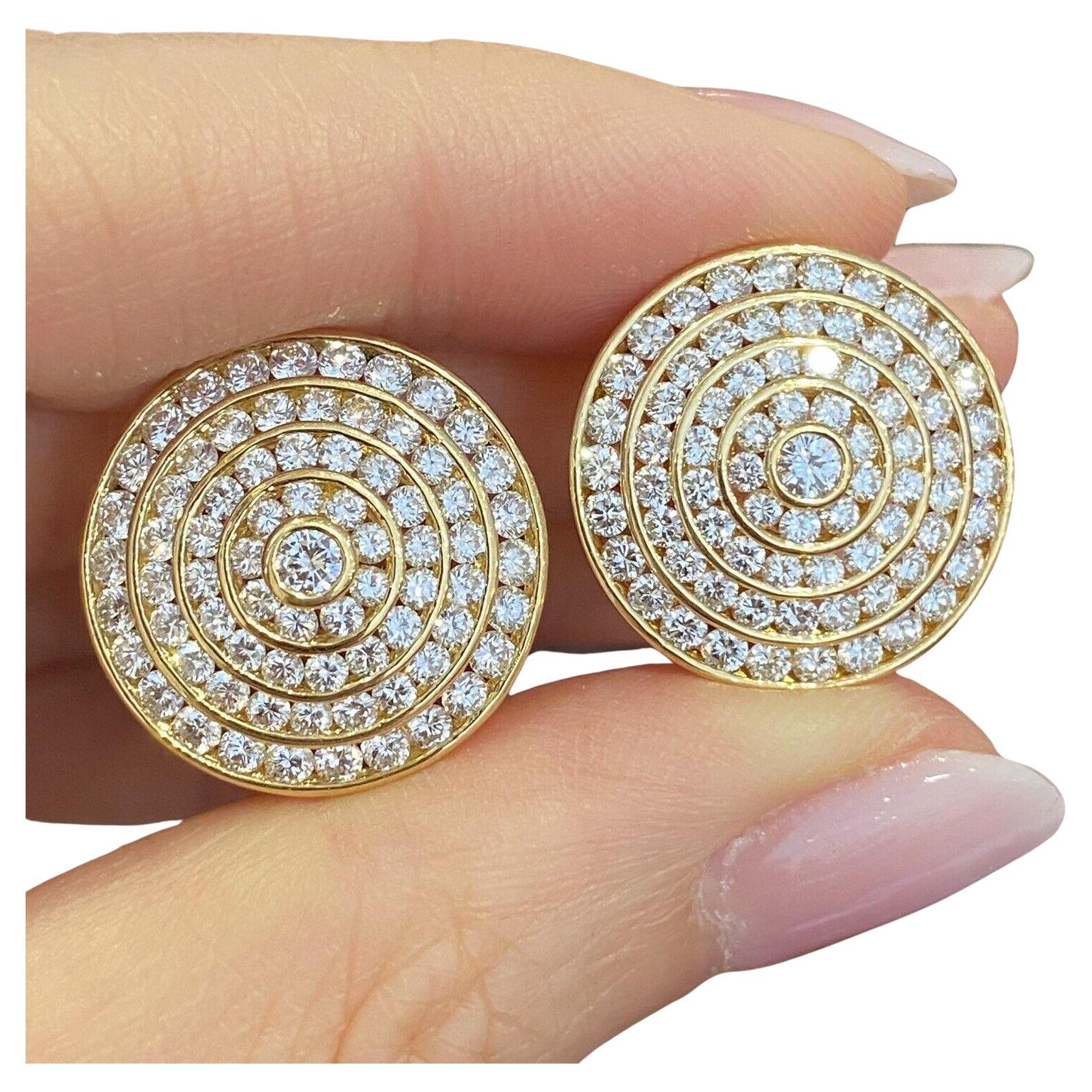 4 Row Circle Diamond Earrings 3.95 carat total weight in 18k Yellow Gold

Round Diamond Earrings features four concentric circles with Round Brilliant Diamonds channel set and one Round Diamond in the center in 18k Yellow Gold. The earrings are