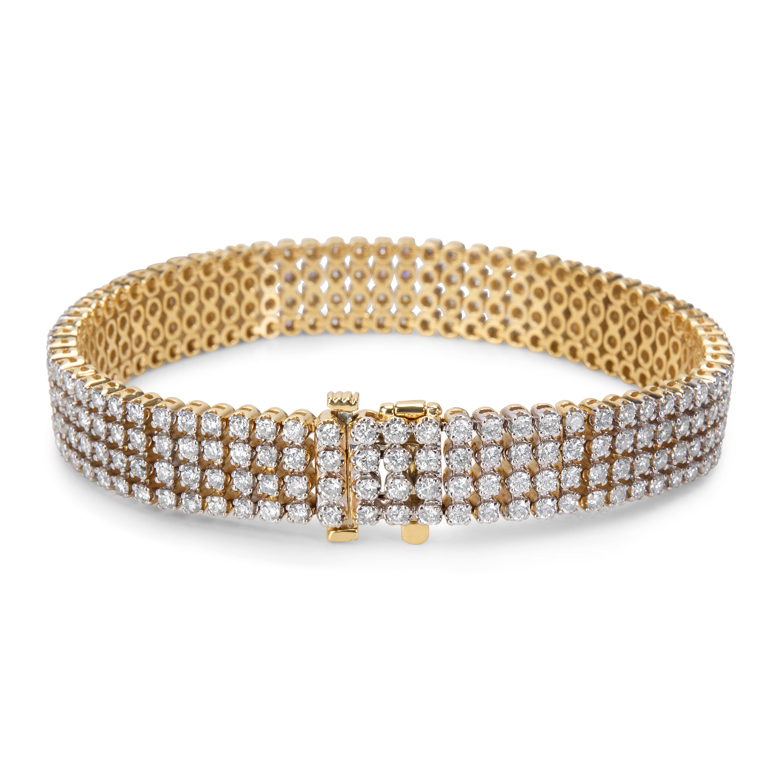 Brand New & unworn.  Four rows of high quality diamonds make up this 14K yellow gold, diamond tennis bracelet.  Bracelet is 6.75 inches in length.

Stone Type: Diamond
# of Diamonds: 280
Stone Weight: 7.00 ctw
Stone Color: G/H/I
Stone Clarity: