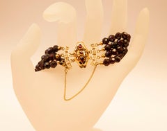 4-Row Garnet Bracelet with 14k Yellow Gold Filigree Closure