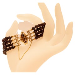 Pulsera de 4 filas de granates con cierre de filigrana de oro amarillo de 14k