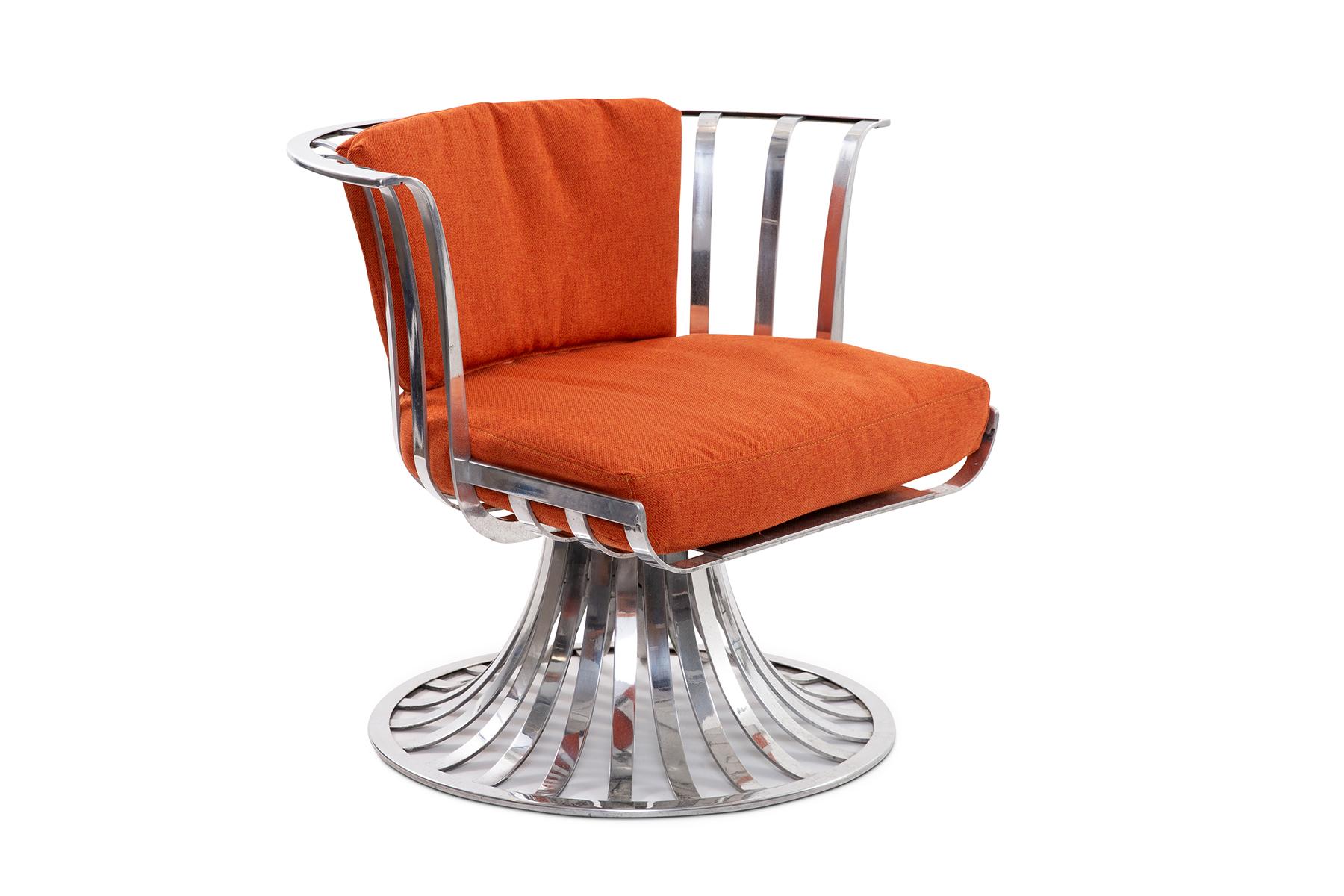 4 slatted aluminum swivel lounge chairs designed by Russell Woodard, circa early 1960s. These examples can be used indoors or out. These have been newly reupholstered in bright orange fabric. Price listed is per chair.