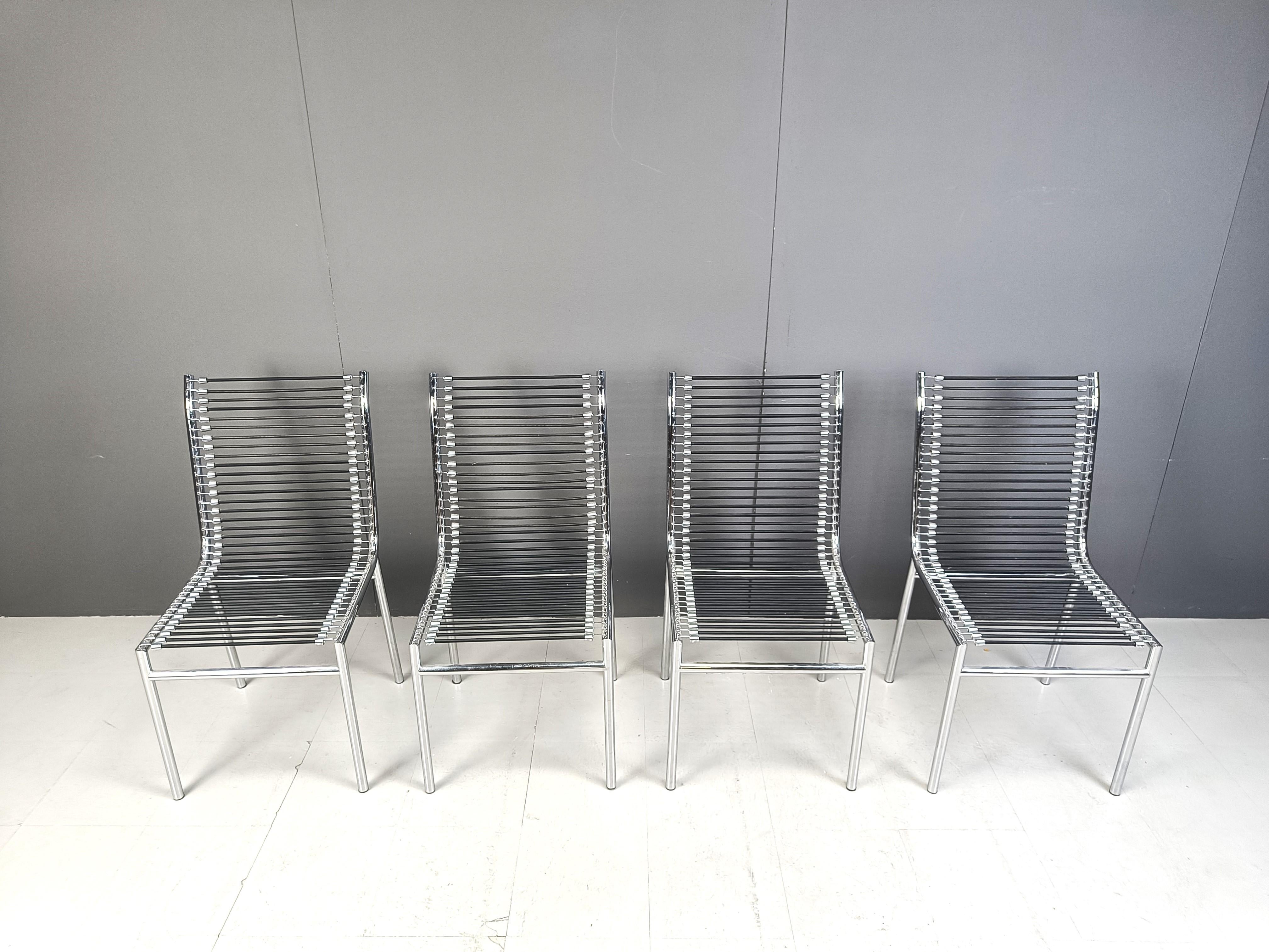 Vintage chromed metal dining chairs with elastic cords designed by rene Herbst in the bauhaus period and produced in the 1980

Very good condition.

1980s - Italy

Dimensions:
Height: 95cm
Width: 50cm
Depth: 50cm
Seat height: 45cm

Price is for the