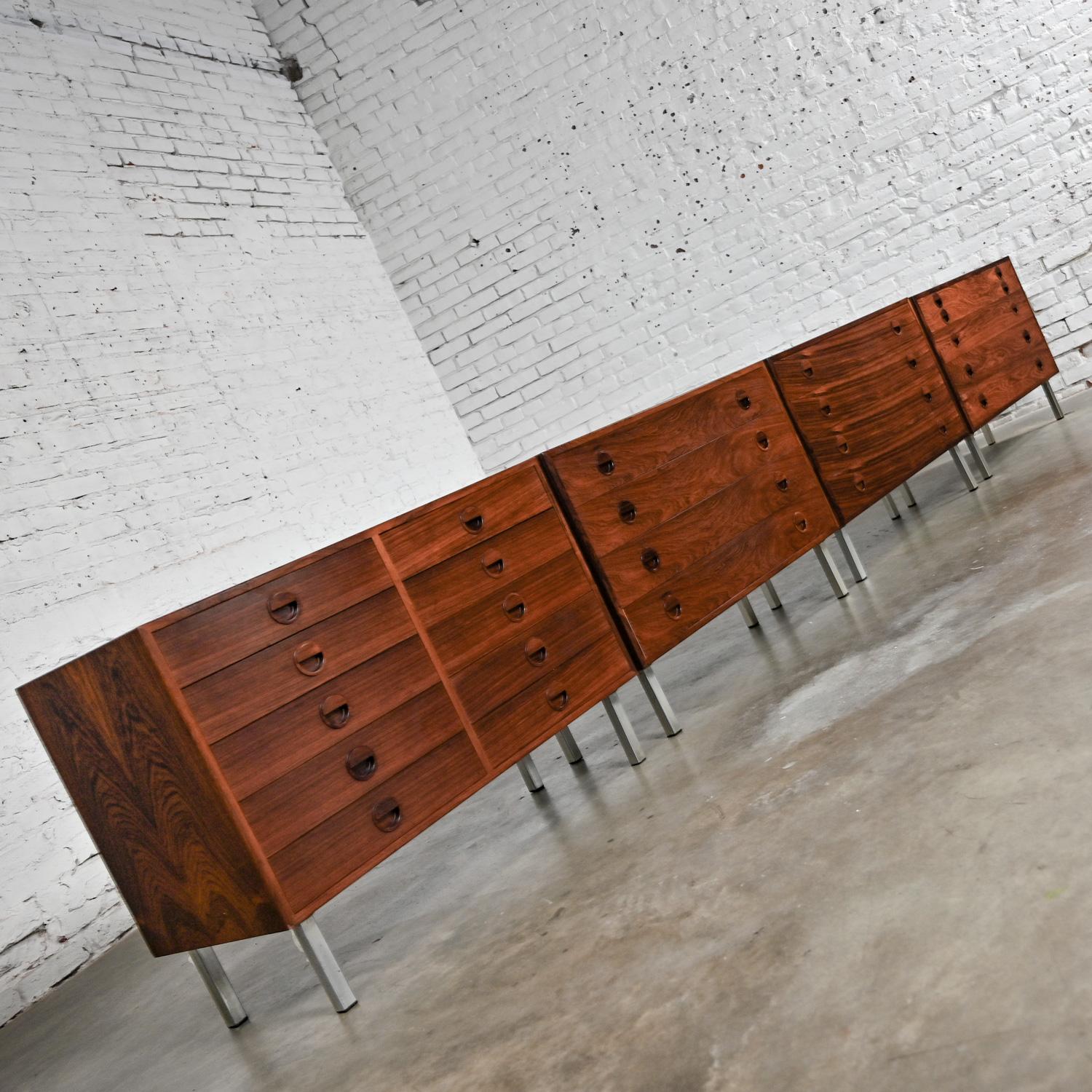 Handsome Mid Century Scandinavian Modern cabinets by Rud Thygesen & Johnny Sorensen for Hansen & Guldborg (a.k.a. HG,). These cabinets are comprised of rosewood with square steel tube legs, a set of 4. They also have a hanging mechanism on the back