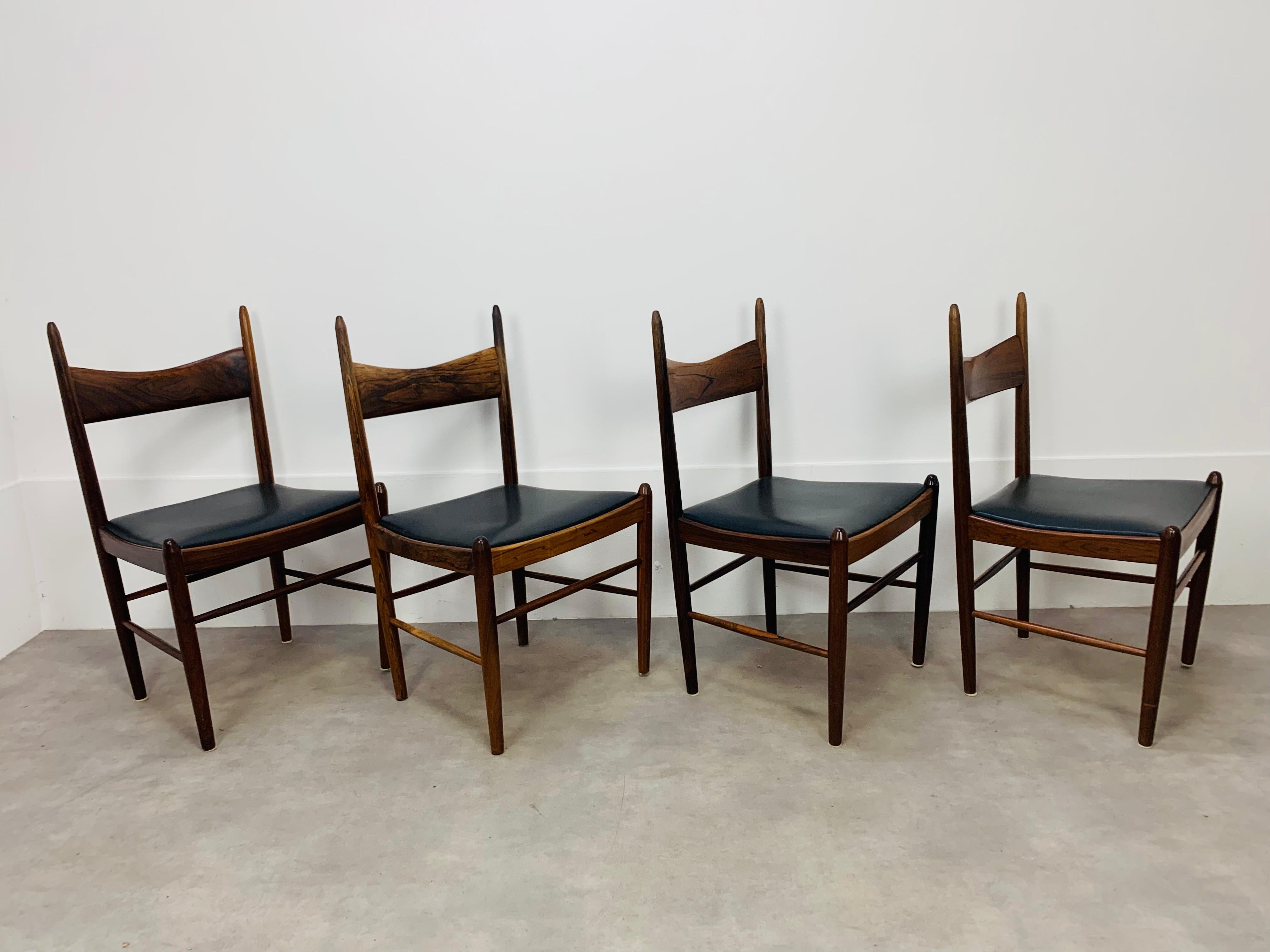 Set of four scandinavian chairs, designed by Vestervig Eriksen for Tomborg Denmark in the 1960's. They're made in beautiful rosewood and black leatherette. They're in very clean condition, the wear is consistent with age and use, there is a slight