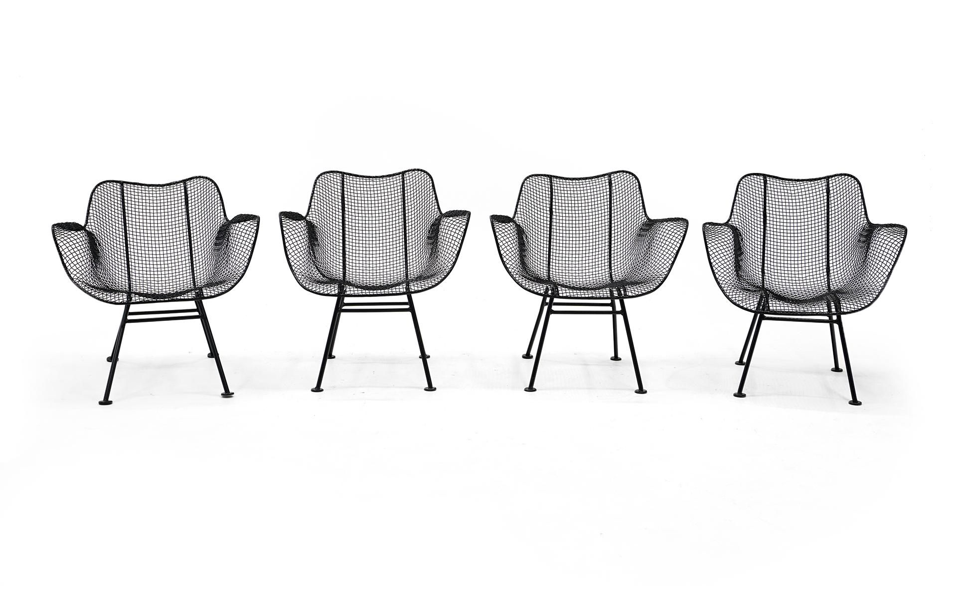 Set of four Sculptura patio / outdoor chairs designed by John Woodard, 1950s. These are originals and have been professionally media blasted and powder coated in a satin black finish. Not a scratch. These are lounge height so they are slightly lower