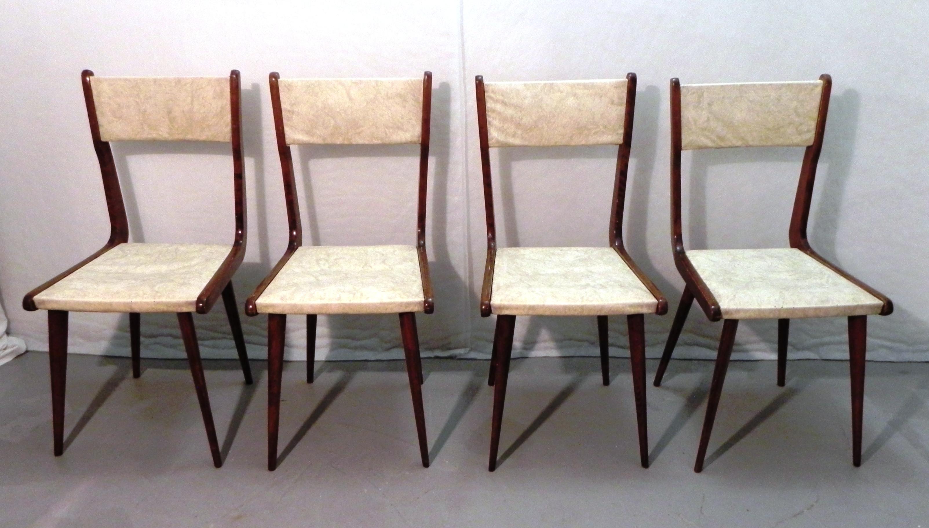 

4 Mid Century Modern chairs in the style of Carlo Ratti 1960s. Wooden shaft, skai covering. The chairs show signs of woodworm; a specific treatment was performed. The upholstery is in good condition, as are the straps under the seat. The chairs