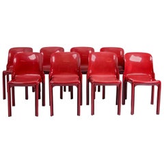 4 Selene Stacking Chairs by Vico Magistretti for Artemide in Dark Red