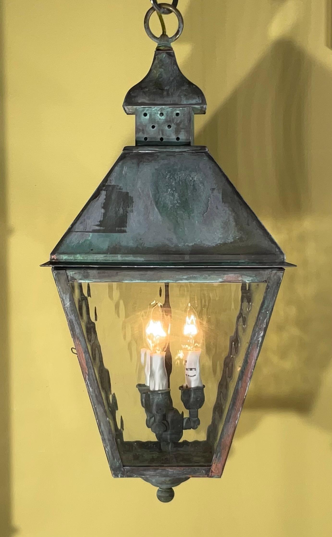 Quality handmade of solid copper and brass  lantern with three 40/watt lights, decorative wave art glass .nice patina . 
Electrified and ready to light. 

Could be used in wet location and indoor.
