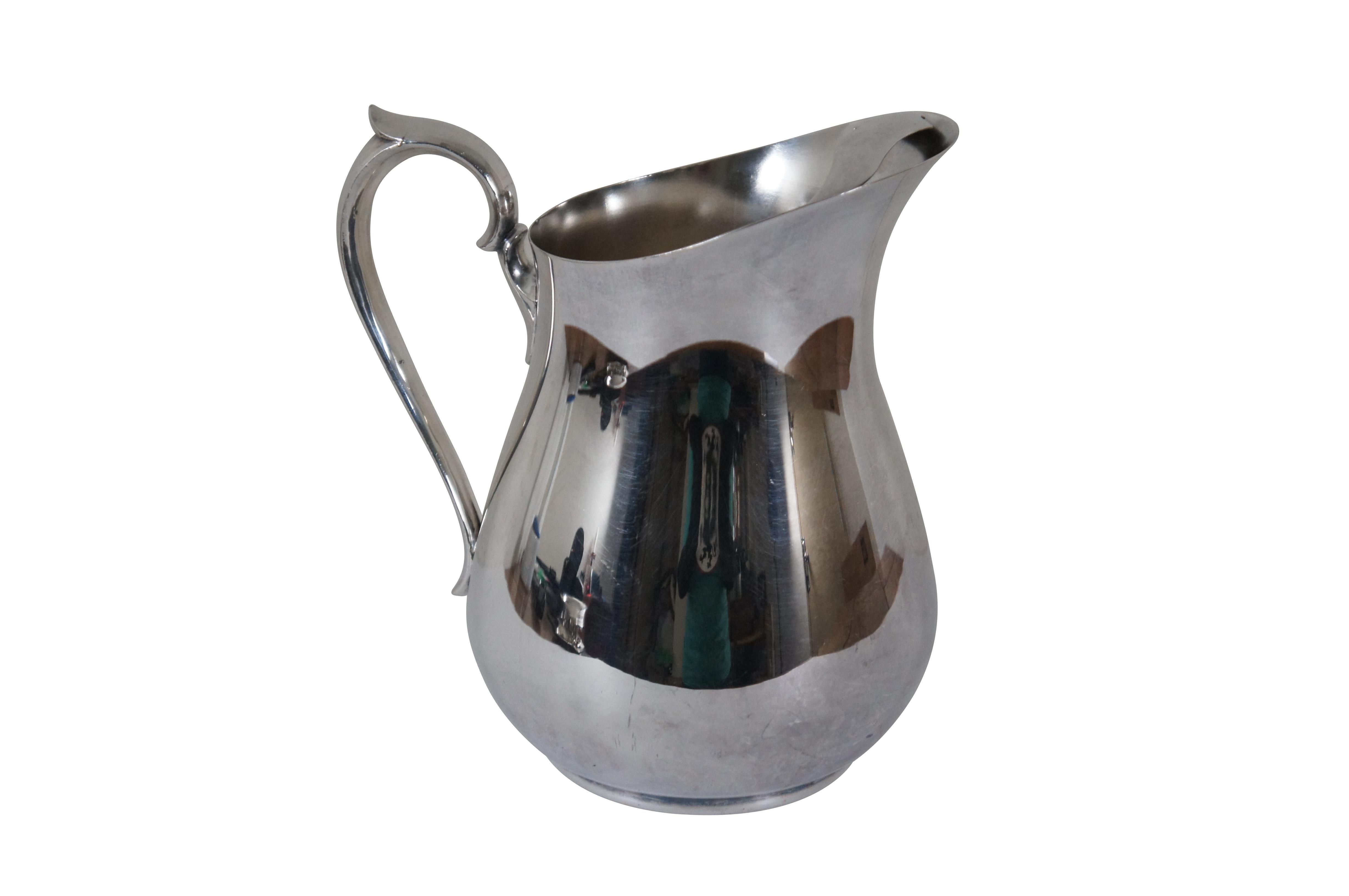scalloped silver jug