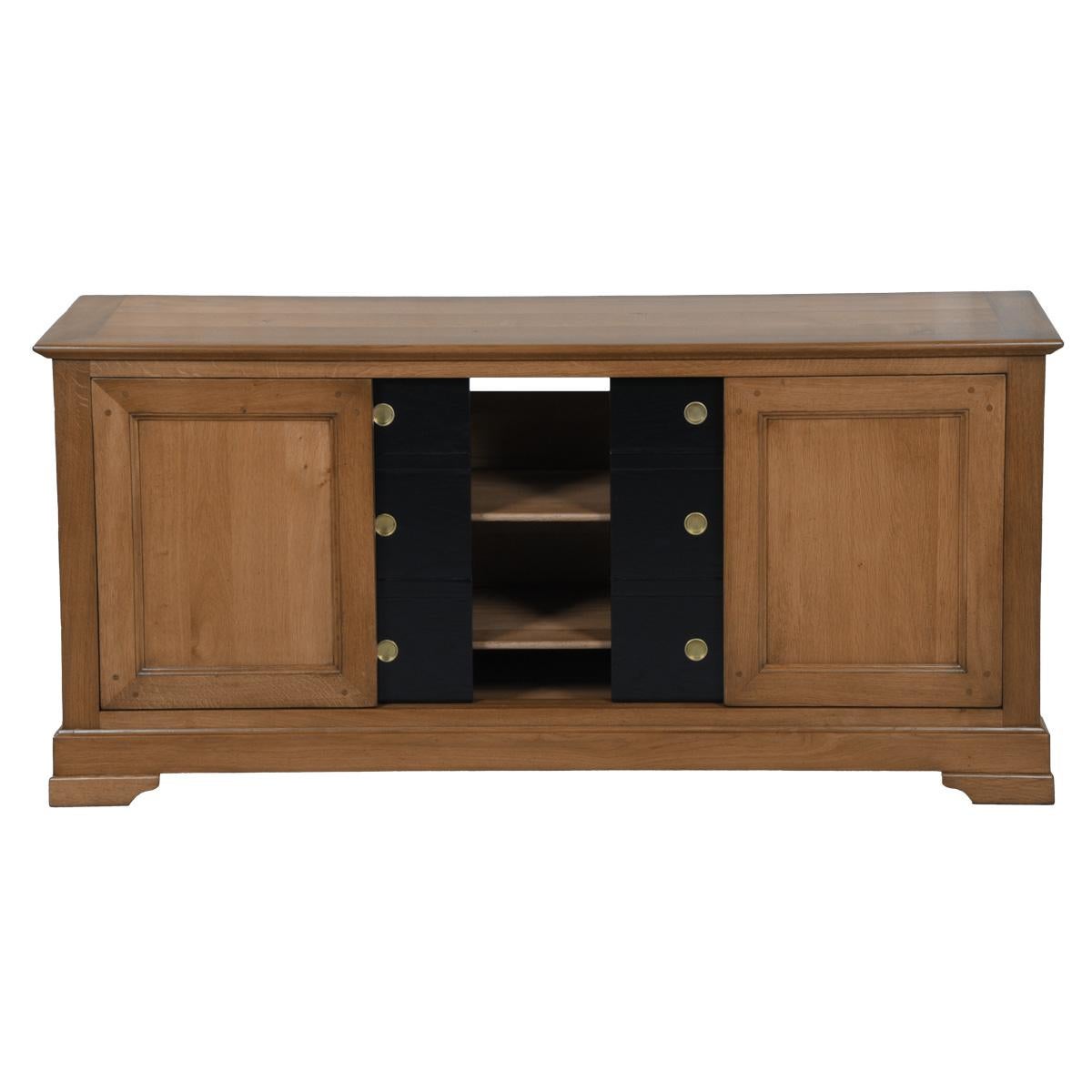 This TV cabinet is a hand made interpretation of the French Louis Philippe style. Created in France in the 19th century , this woodworking is caracterized by its curved moldings, hand-curved feet and rounded design.

4 sliding doors allow you to