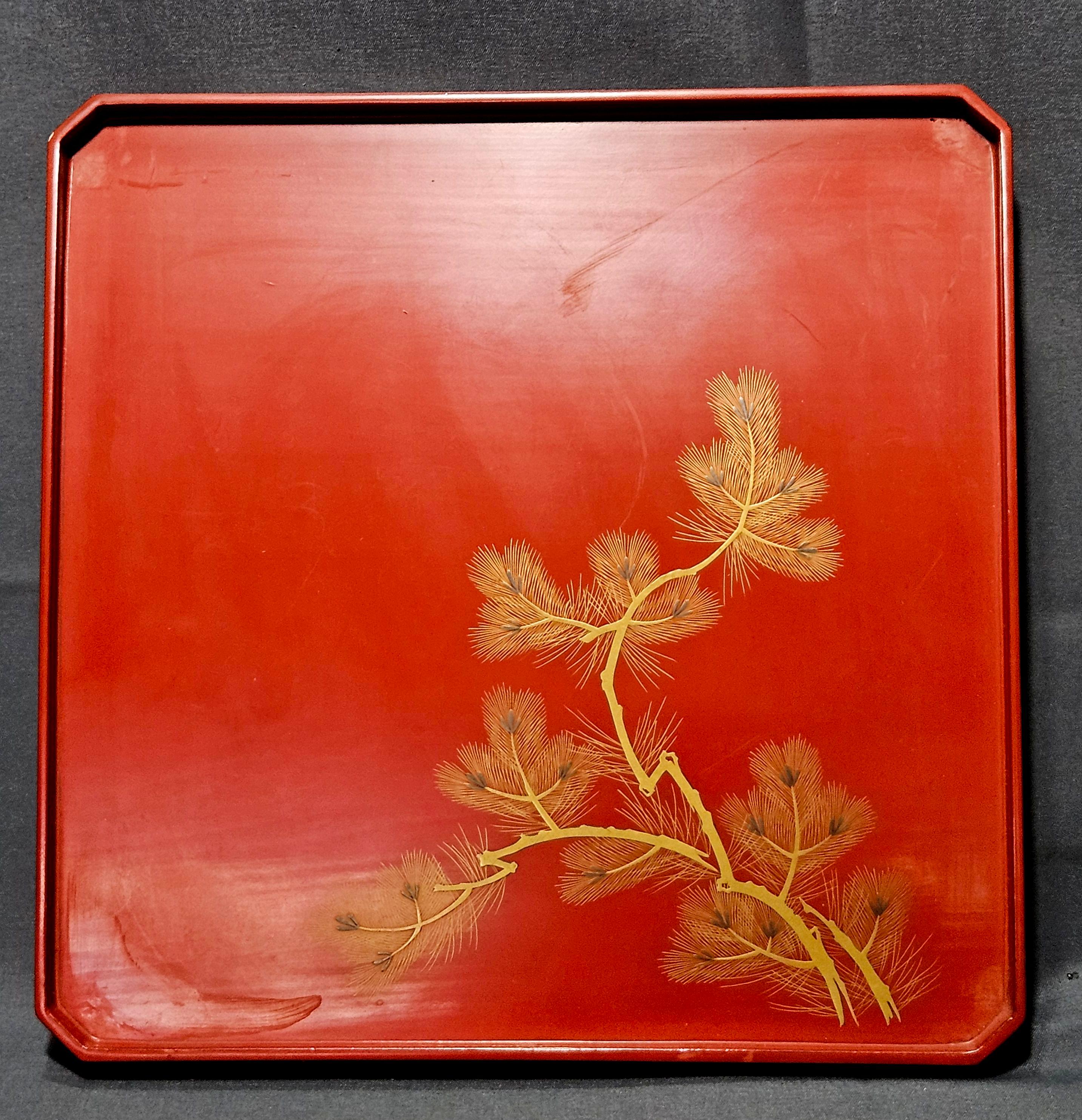 (4) Square red footed trays, with gilt pine frond decoration, 9.125