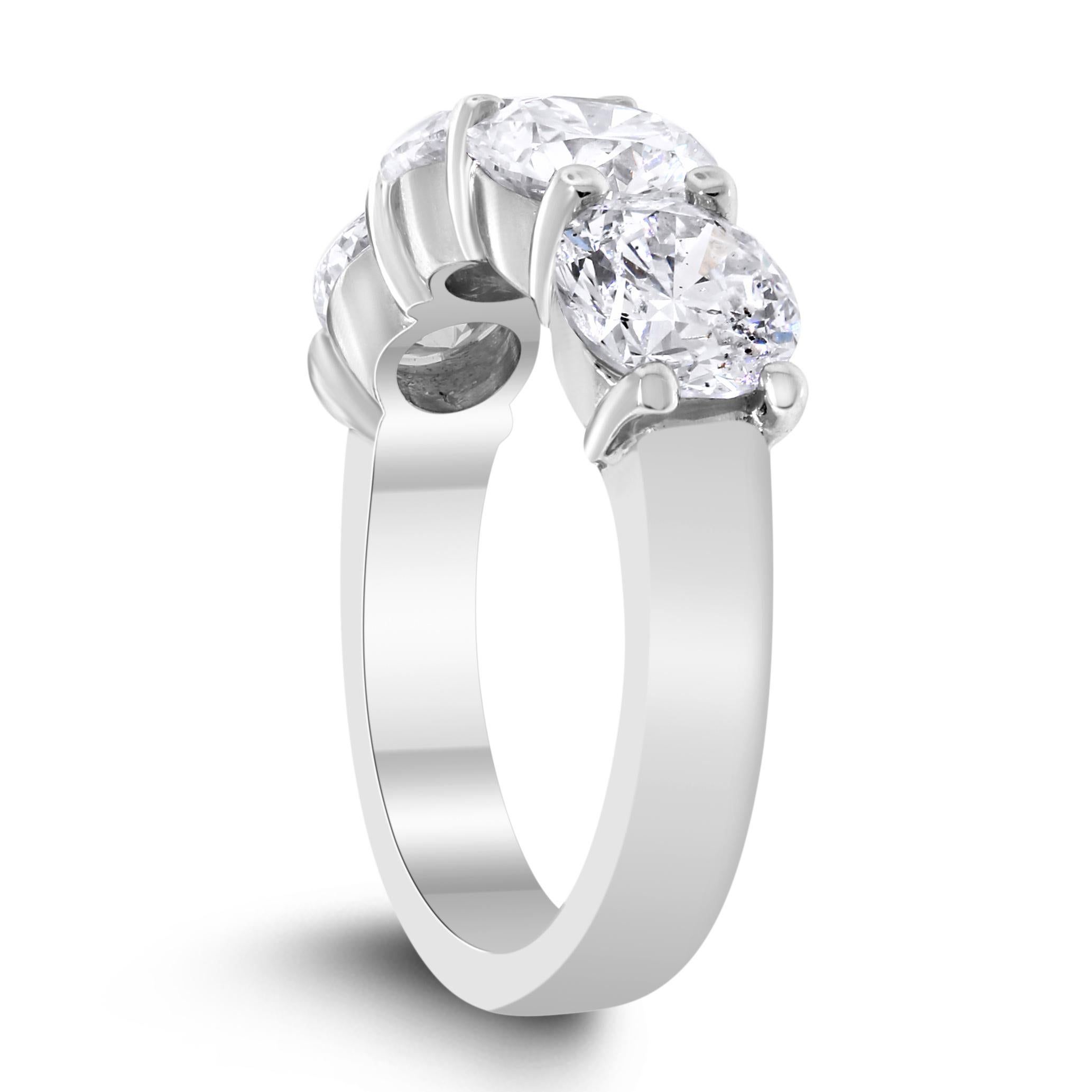 This 4 Diamond Band is a simple and classic style that compliments and enhances any traditional engagement ring, yet also makes a statement worn independently. 
The 4 H Color SI1 Clarity diamonds are eye clean and ideally matched to create a