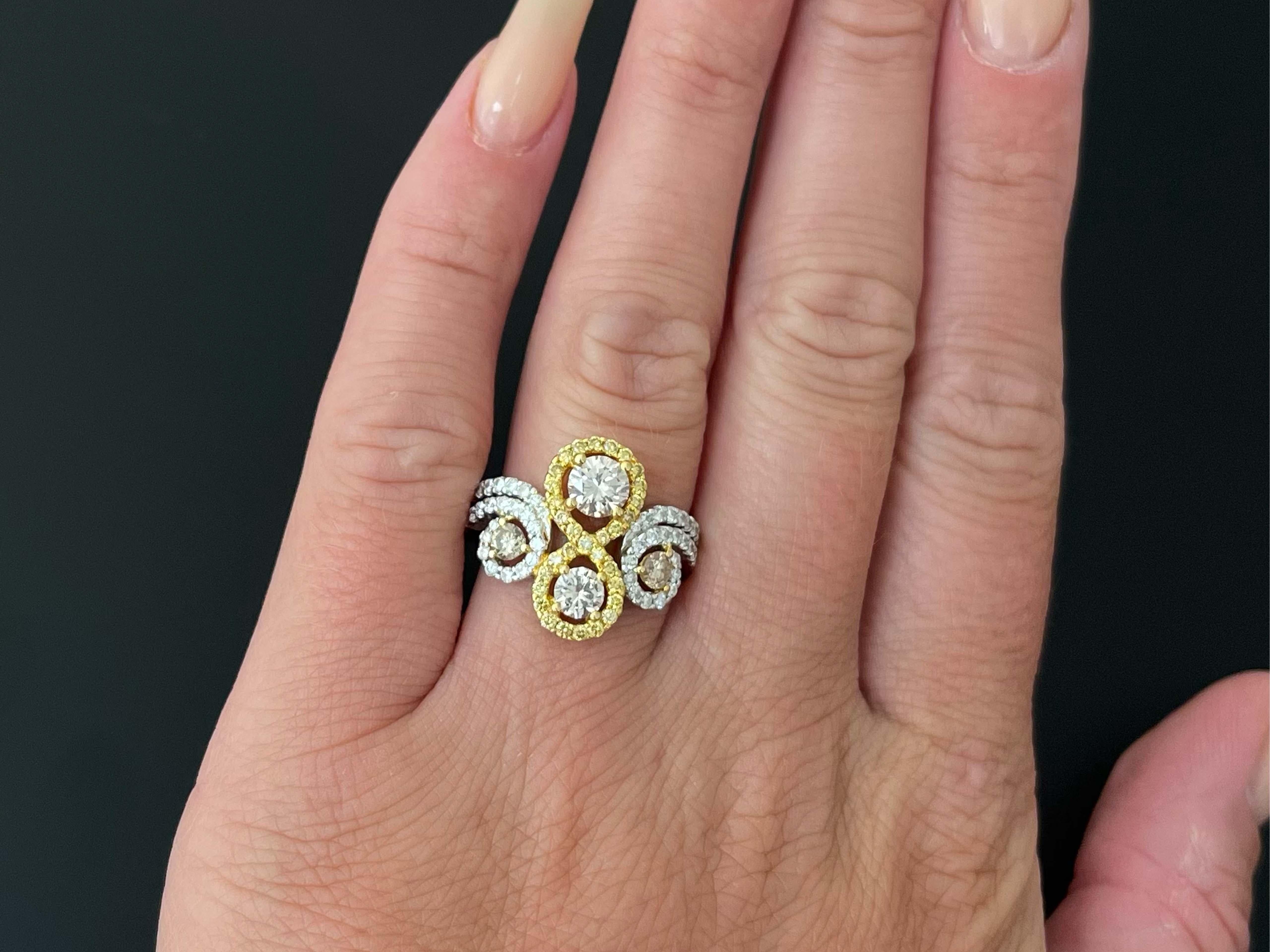4 Stone Infinity Diamond Ring, Champagne, Yellow and White Diamonds in 18k White Gold. This stunning ring features 4 sparkly champagne diamonds prong set and VS in clarity. Two of these diamonds are surrounded by fancy intense yellow diamonds in an