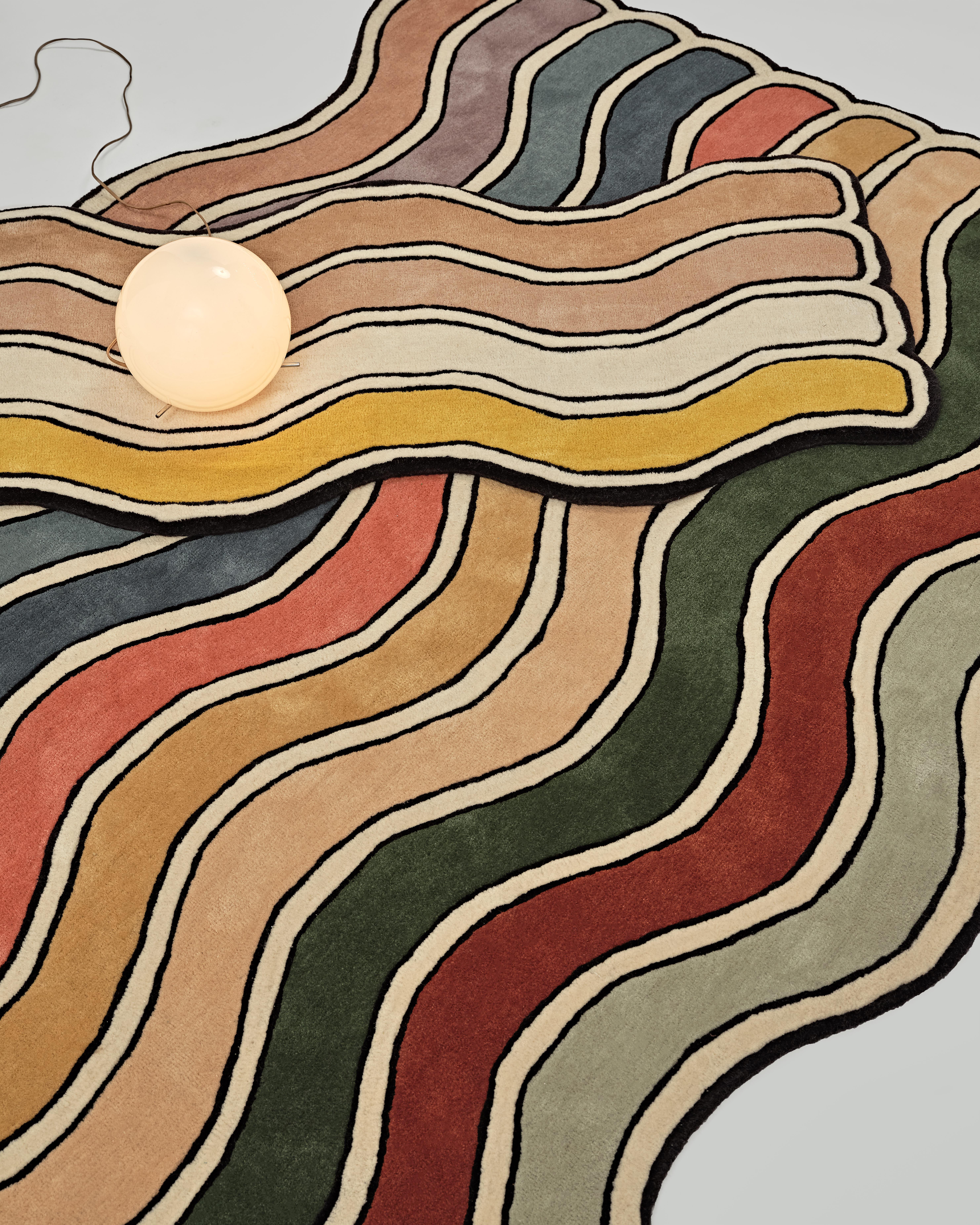 The “Court Series” rugs are hand-tufted with blended wool and viscose material dyed in hyper-saturated colors, with tennis court-like geometries represented both via overlaid graphics as well as the cut and shape of individual segments.

Custom