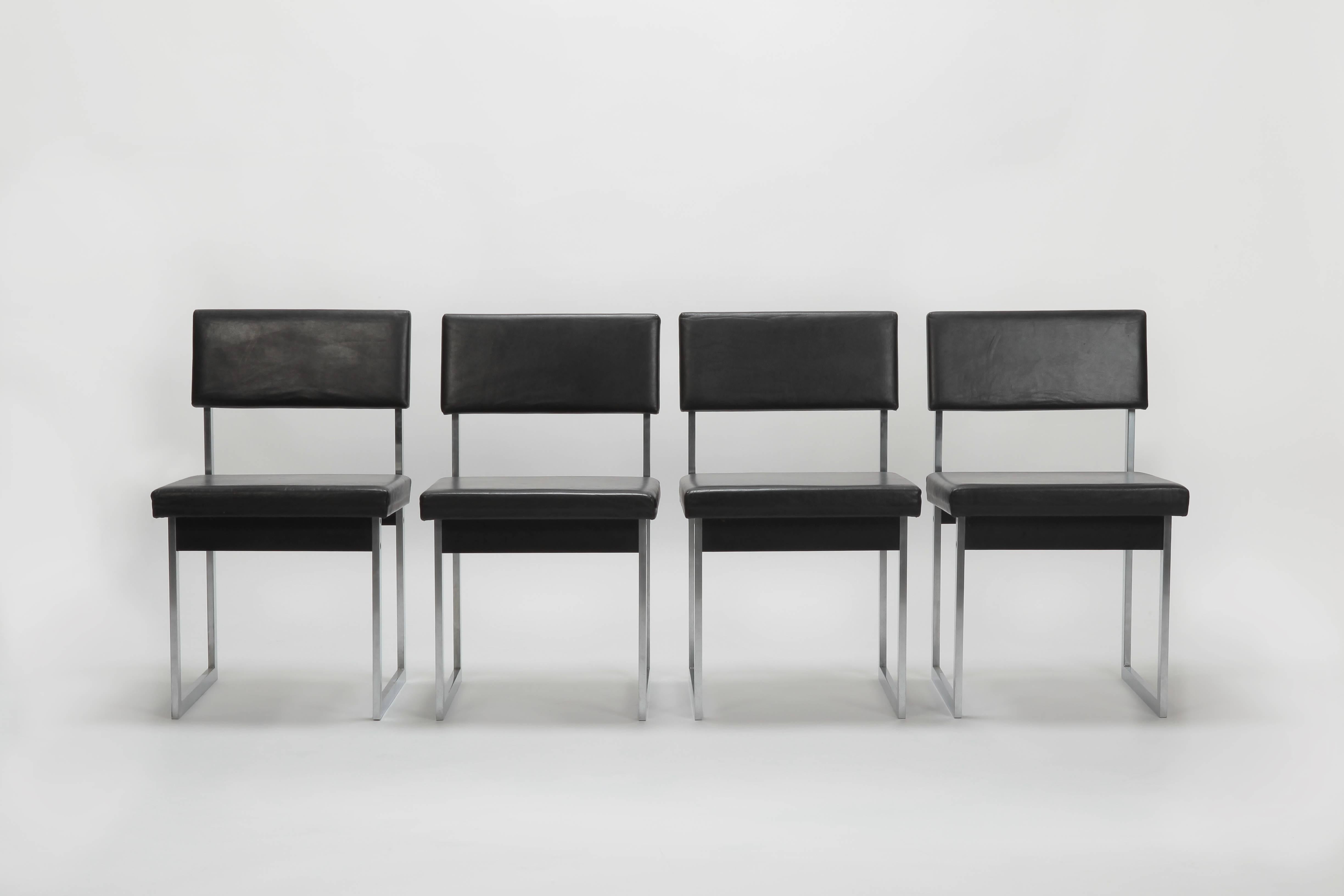 Four Swiss steel chairs manufactured in the 1960s. The chair are in the style of George Nelson. Cleanly processed rectangular steel tubing, seat and back rest are covered with very soft black leather.