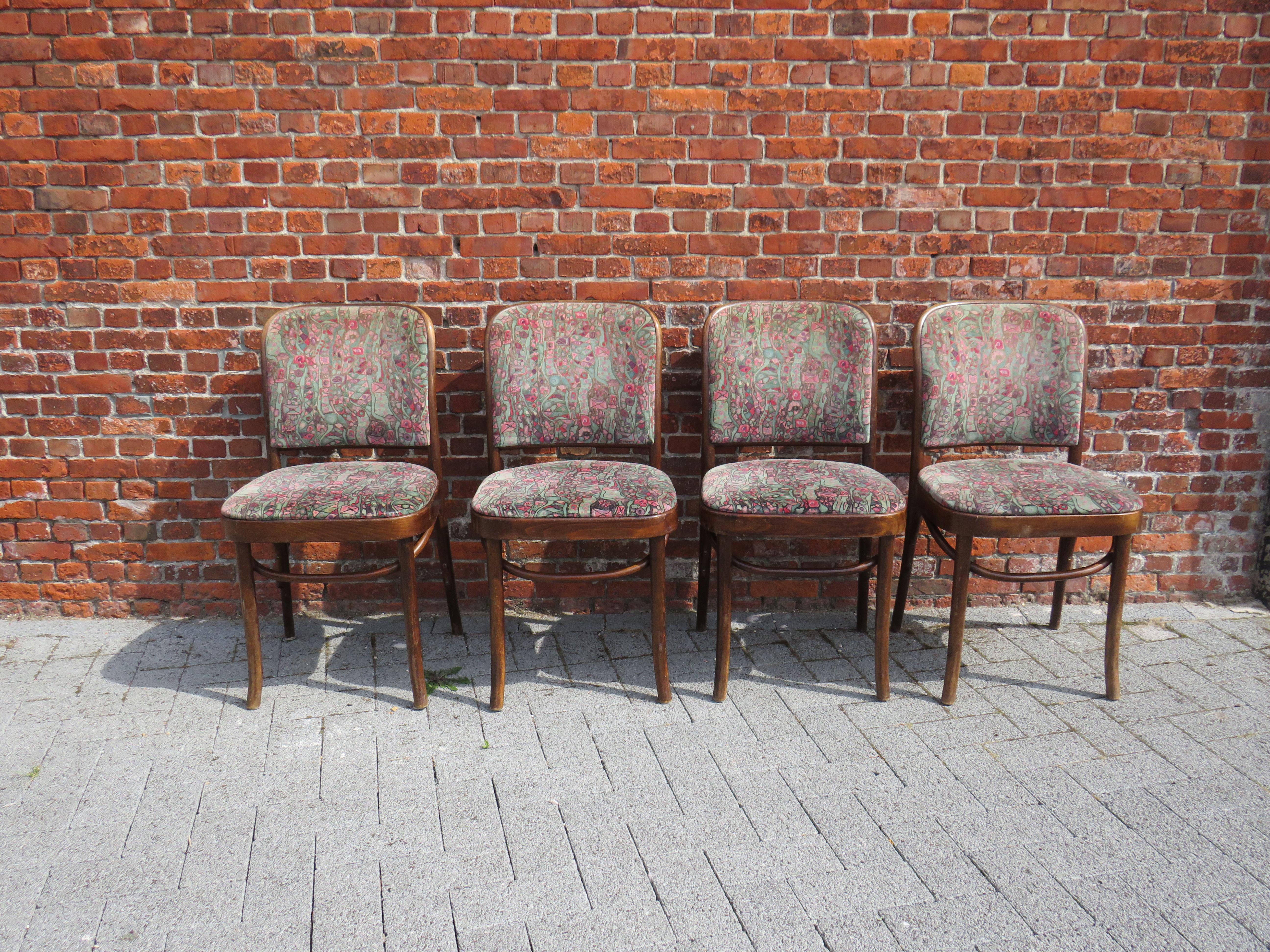 The chairs were designed by Josef Hoffmann for Thonet around 1920 and executed by FMG - Fabryka Mebli Gietych - in Poland in the first half of the 20th century. They have been reupholstered over the years, presumably between 1970 and 1980.
The