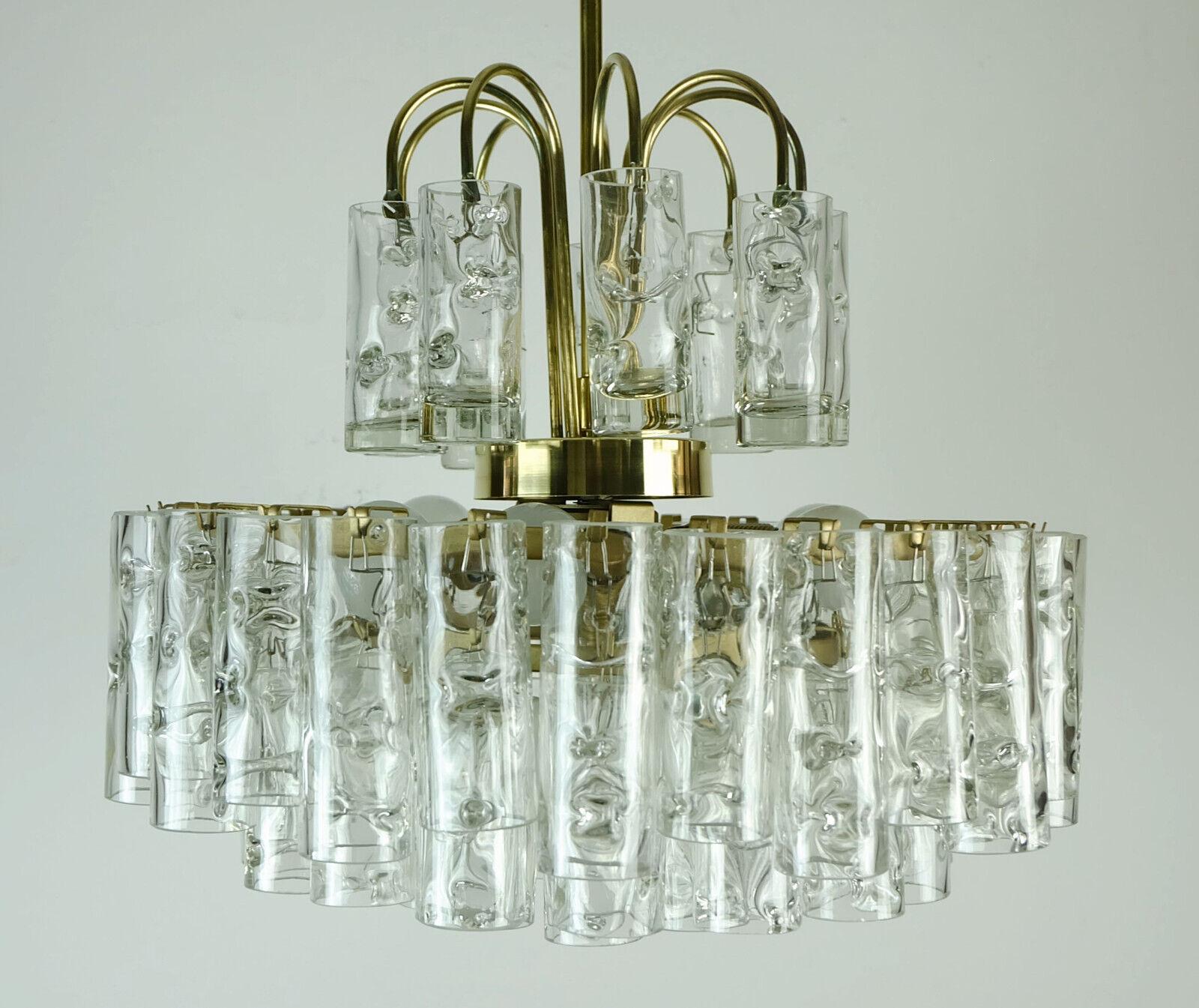 Beautiful chandelier manufactured by Doria Leuchten (Doria-Werk Walter Donner GmbH & Co. KG, Fürth) in the 1960s. The frame is made of matt gold painted metal. 53 tubes made of structured glass hang from it, arranged in three tiers, above which