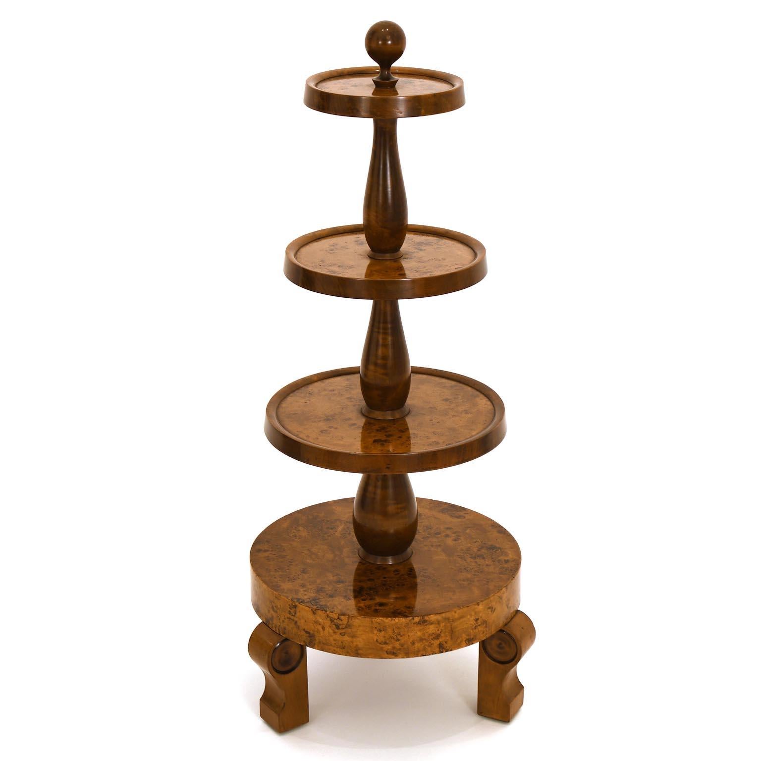Fine 4-tier étagère from 1920 made of mahogany and stained bird´s-eye maple. The wooden base is polished with schellac.
The heights of the levels are 22 cm, 45 cm, 68 cm and 91 cm, the diameters of the levels are 39 cm, 33 cm, 27 cm and 21 cm.
We
