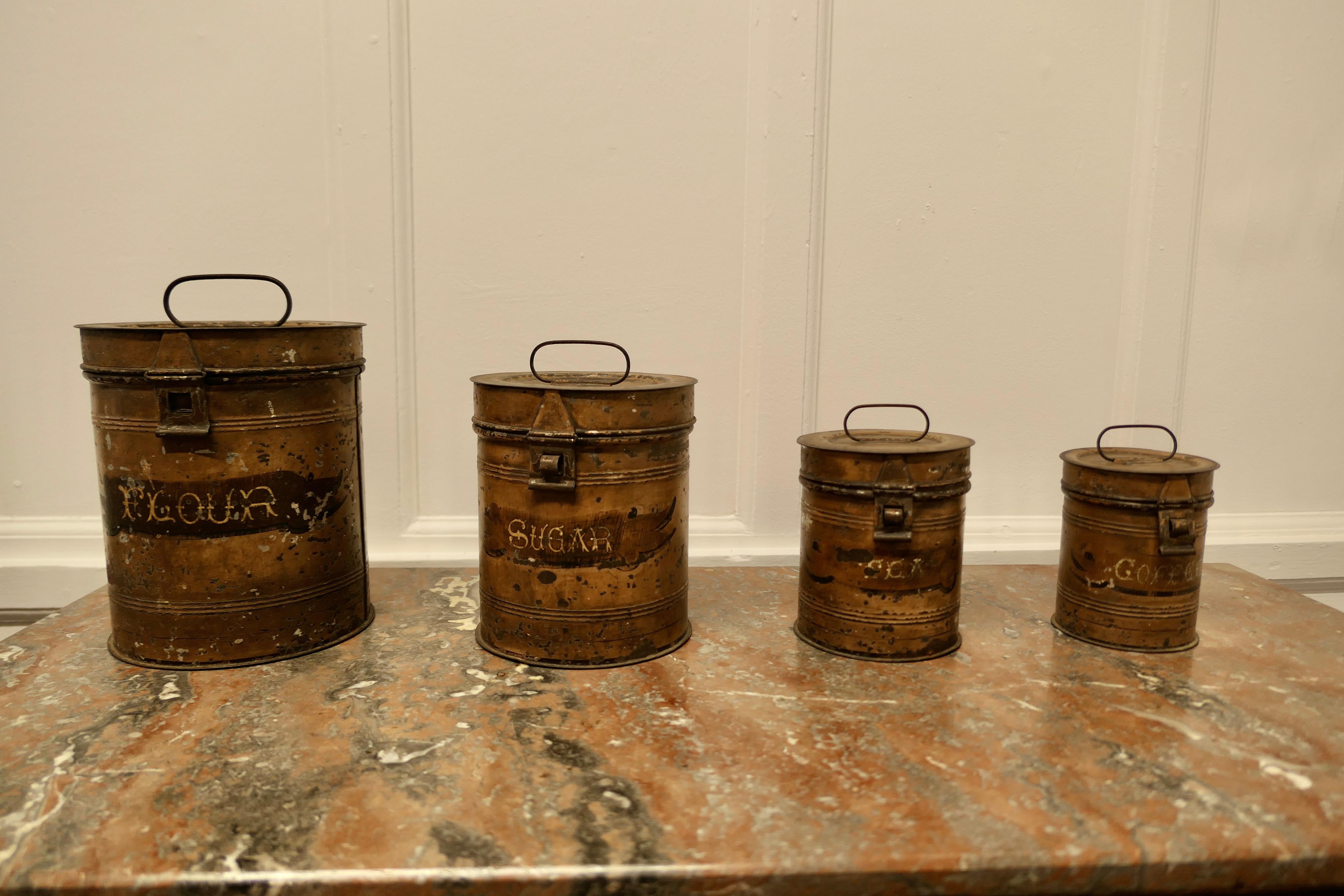 4 Tolewear Kitchen Food Canisters

This is a good well used set of 19th Century Storage Tins
The tins are cylindrical and have tight fitting hinged lids, they are in slightly shabby condition, they are about 150 years old, they have handles on the