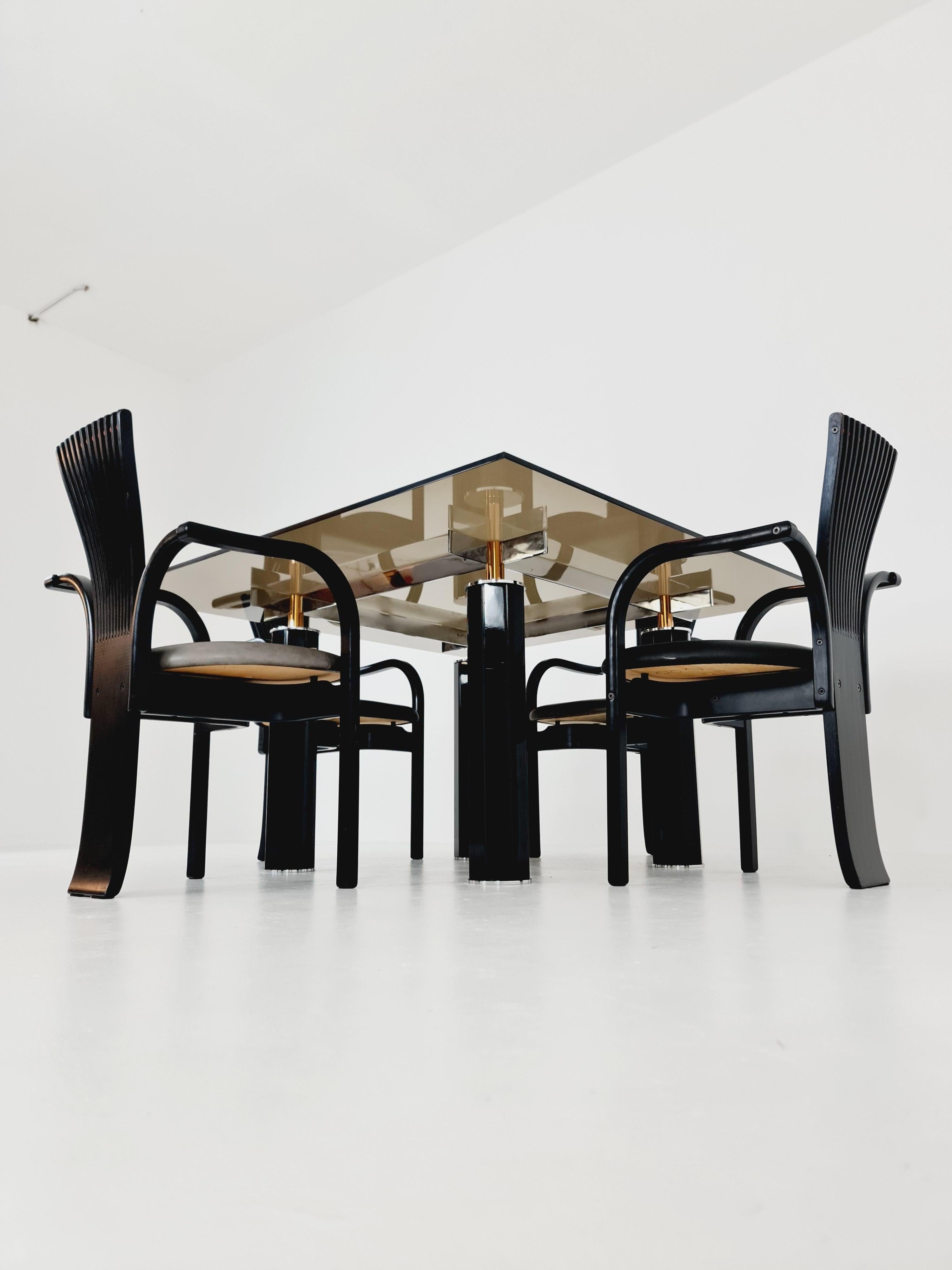 Set of 4 Mid Century Totem dining chairs by Torstein Nilsen for Westnofa with Italian design dining table .Norway 1980s

Beautiful vintage Set of 4 dining chairs, with table ,model Totem, by Torstein Nilsen for Westnofa, Norway.
They are in black