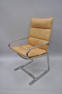 Four Tubular Chrome Cantilever Style Arm Chairs by Cosco Inc after Milo Baughman