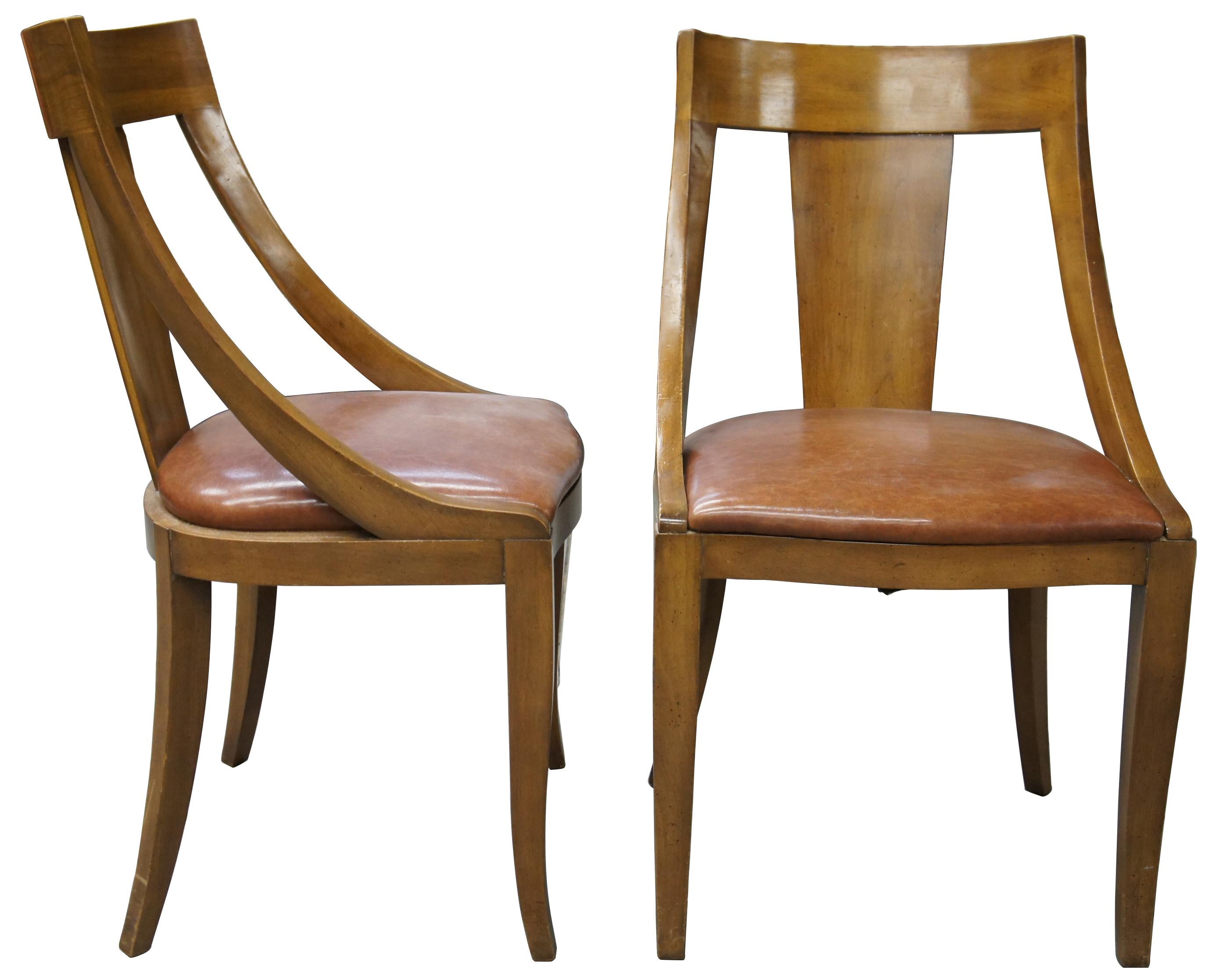 Italian Provincial dining chairs by Union National of Jamestown New York, circa 1950s. Made from fruitwood in French Empire form with Parma finish. Features a leather seat, tapered from legs and saber feet.
   
