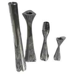 4 Various Size and shaped Nambe Polished Aluminum Candleholders