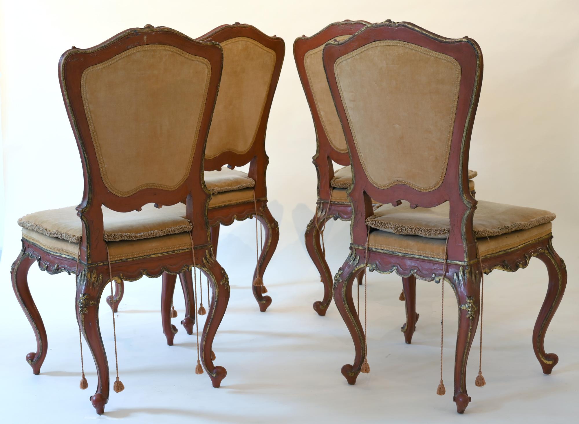 A set of four Venetian chairs 18th century red lacquered painted partially giltwood, Italy

A set of four very charming and rare chairs from Venice. The wood is red lacquered painted and some parts are giltwood. Very special is the fine carving