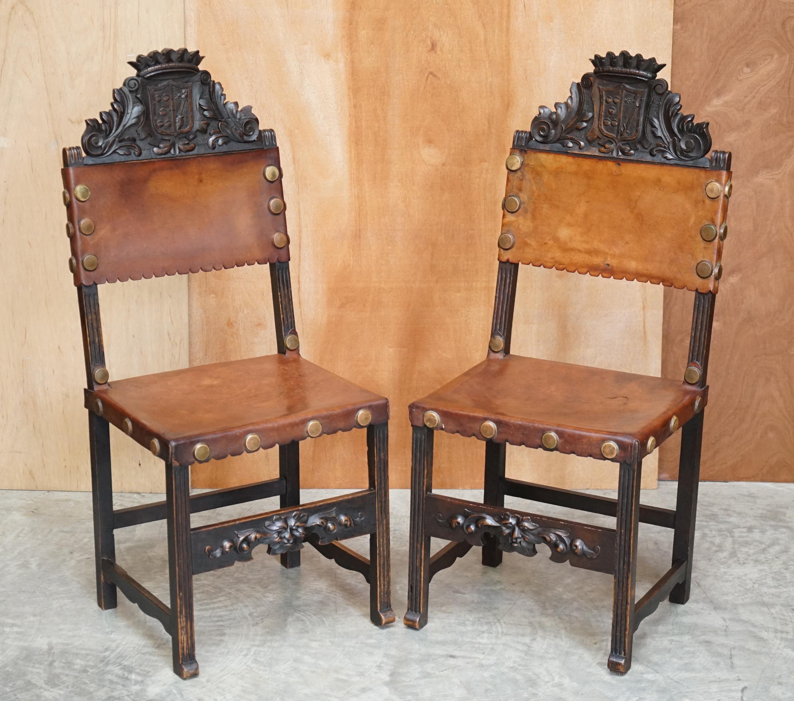 We are delighted to offer for sale this lovely circa 1880-1900 English hand carved oak with brown leather dining chairs that have coat of arms armorial crests to the top finished with crowns

I have never seen this exact chair before, the coat of