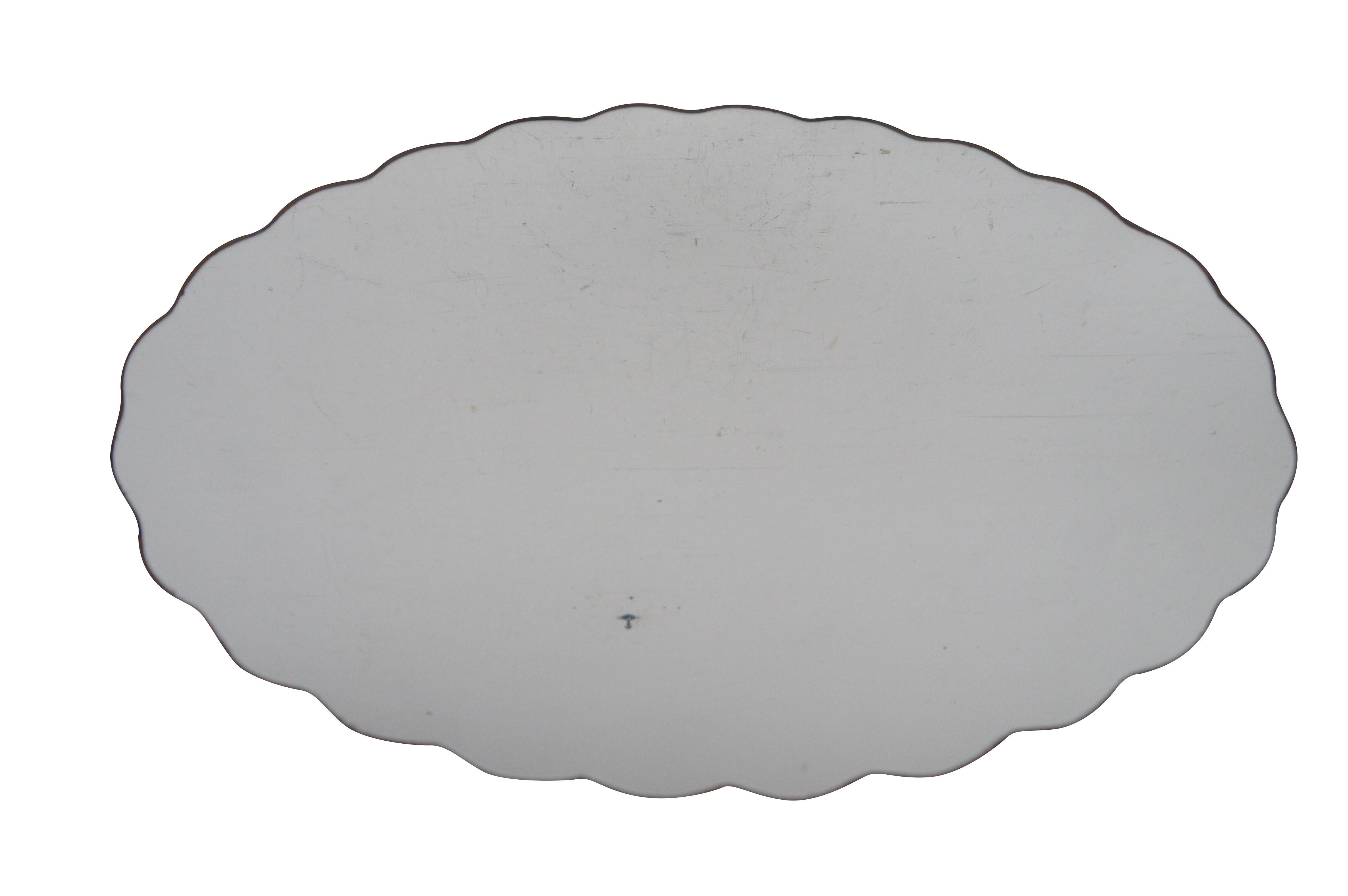 Vintage custom made Falconer Durever mirrored place mats.  Made of glass featuring French style scalloped oval form.  This very hard cut to make was ordered by our client circa June 18, 1982.  

DUREVER FALCONER MIRRORS is a trademark of FALCONER