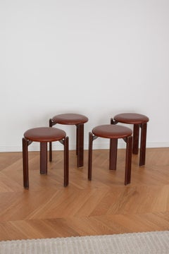 4 Taburetes vintage Bruno Rey de 3 patas en madera oscura con cuero by Dietiker