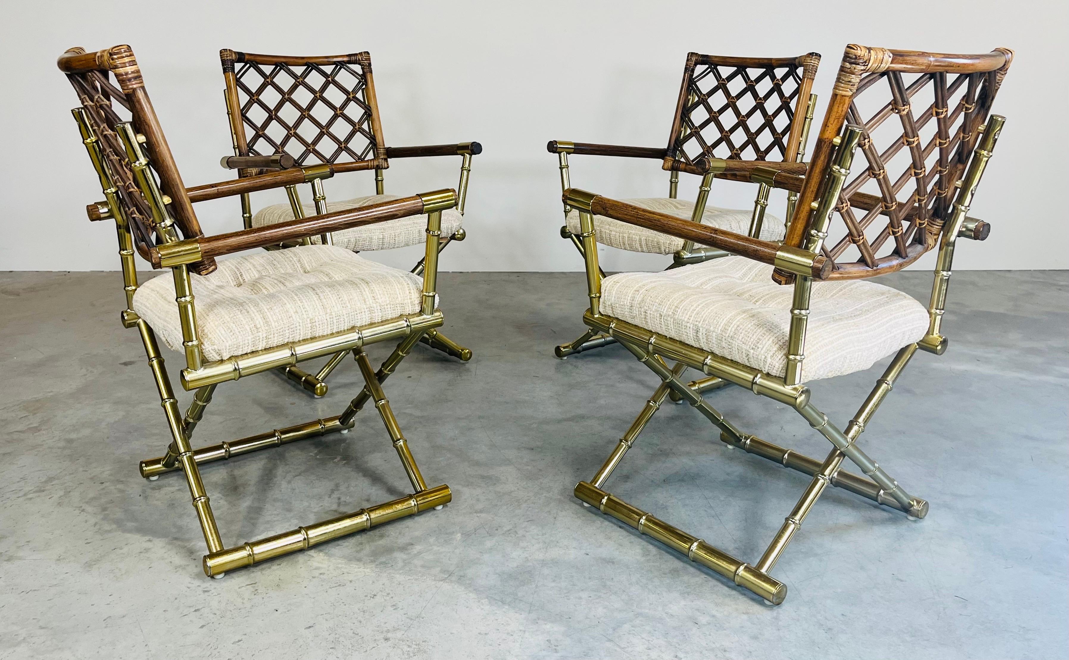 A set of 4 Hollywood Regency armchairs having faux bamboo brass X-form bases with cane wrapped bamboo lattice backrests and neutral tweed soft cushion seats by Daystrom circa 1985. Very attractive and comfortable. In great condition with solid