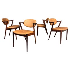 4 Vintage Danish Mid Century Rosewood Dining Chairs Model 42 by Kai Kristiansen