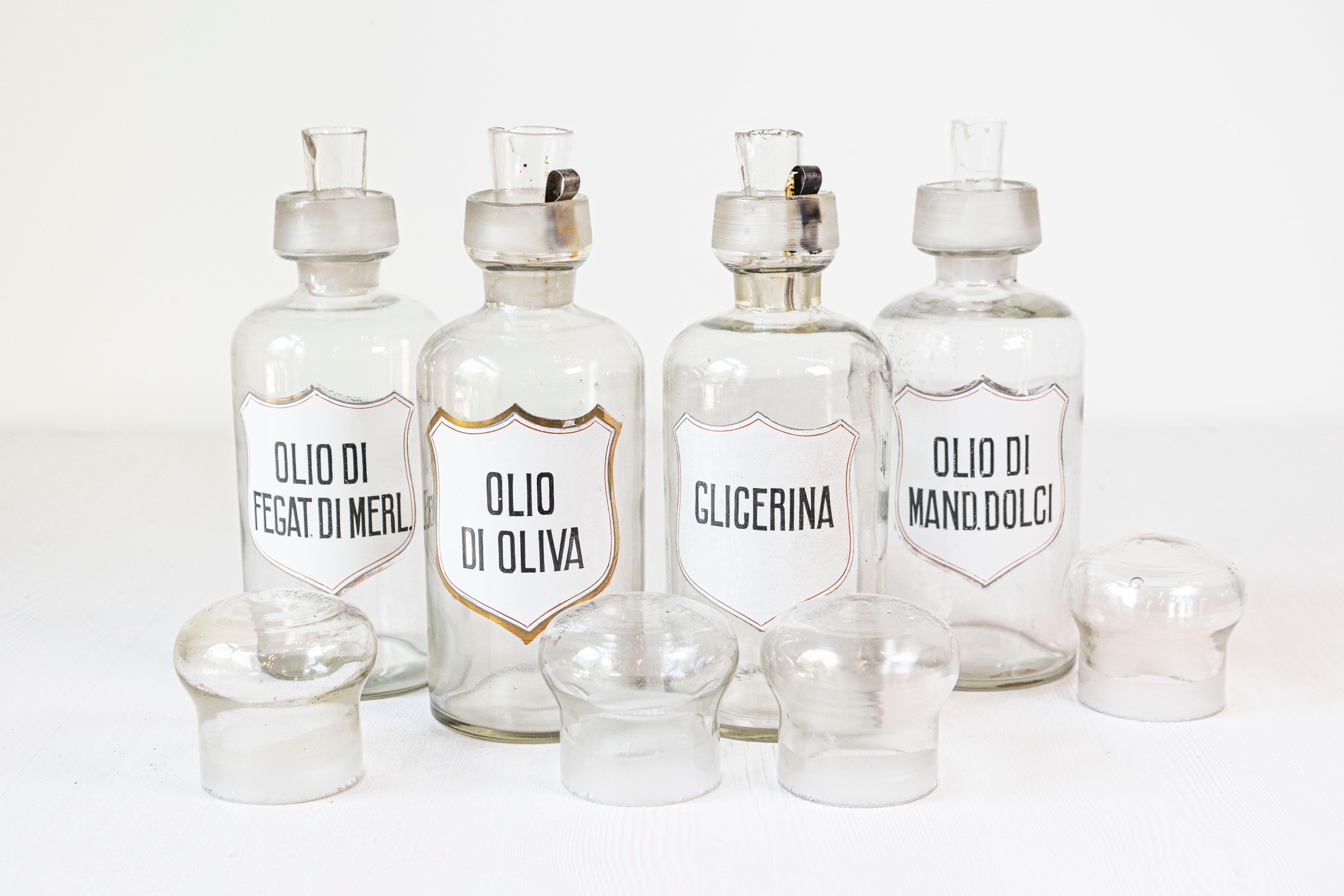 36 Italian pharmacy jars from the 20th century made of either white porcelain or glass and sold individually. Immerse yourself in a piece of history with these charming Italian pharmacy jars, a collection of 36 individual vessels dating back to the