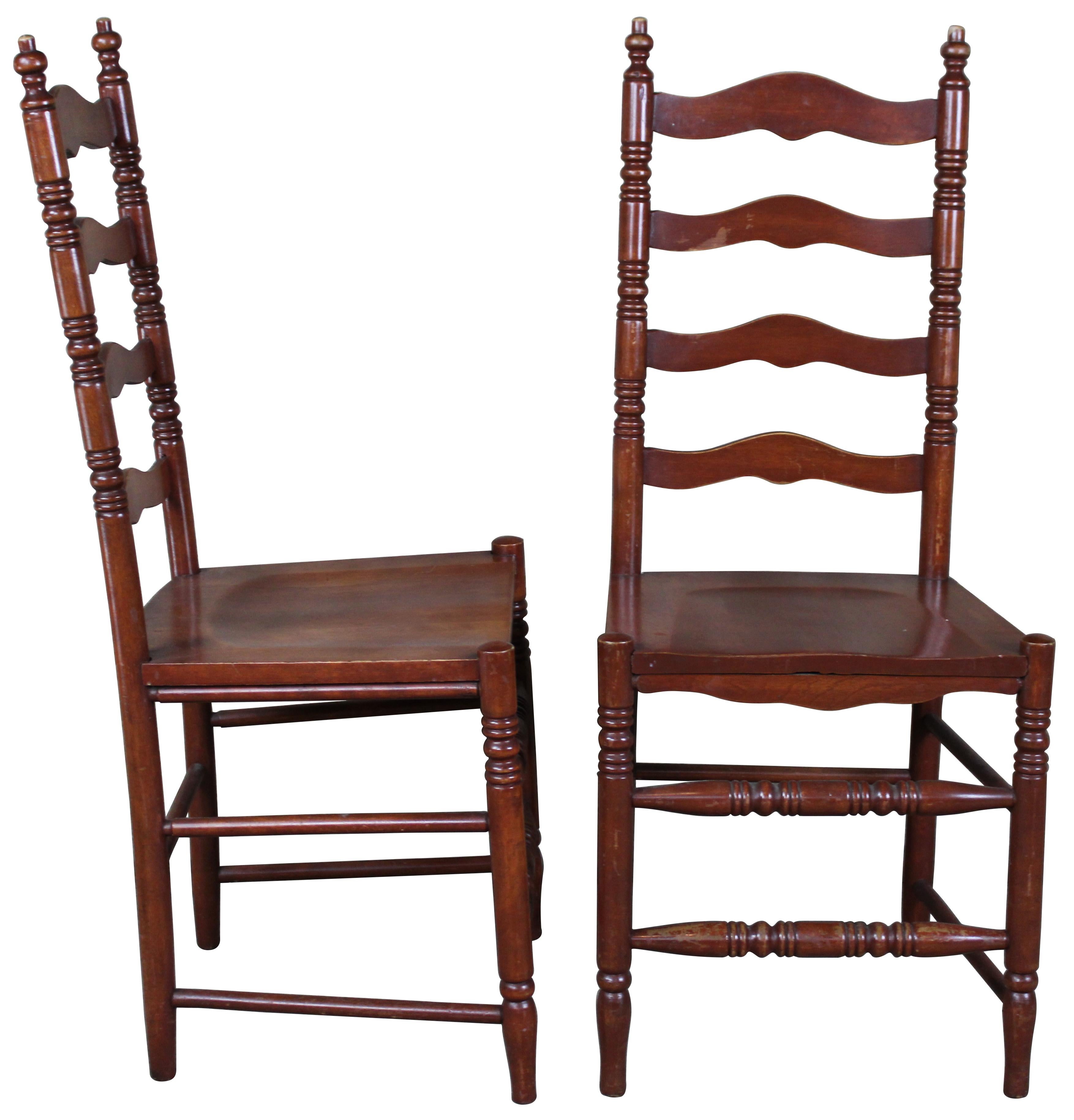 Four vintage Shaker style ladder back dining chairs. Made of maple, featuring classic turned legs and supports.
 