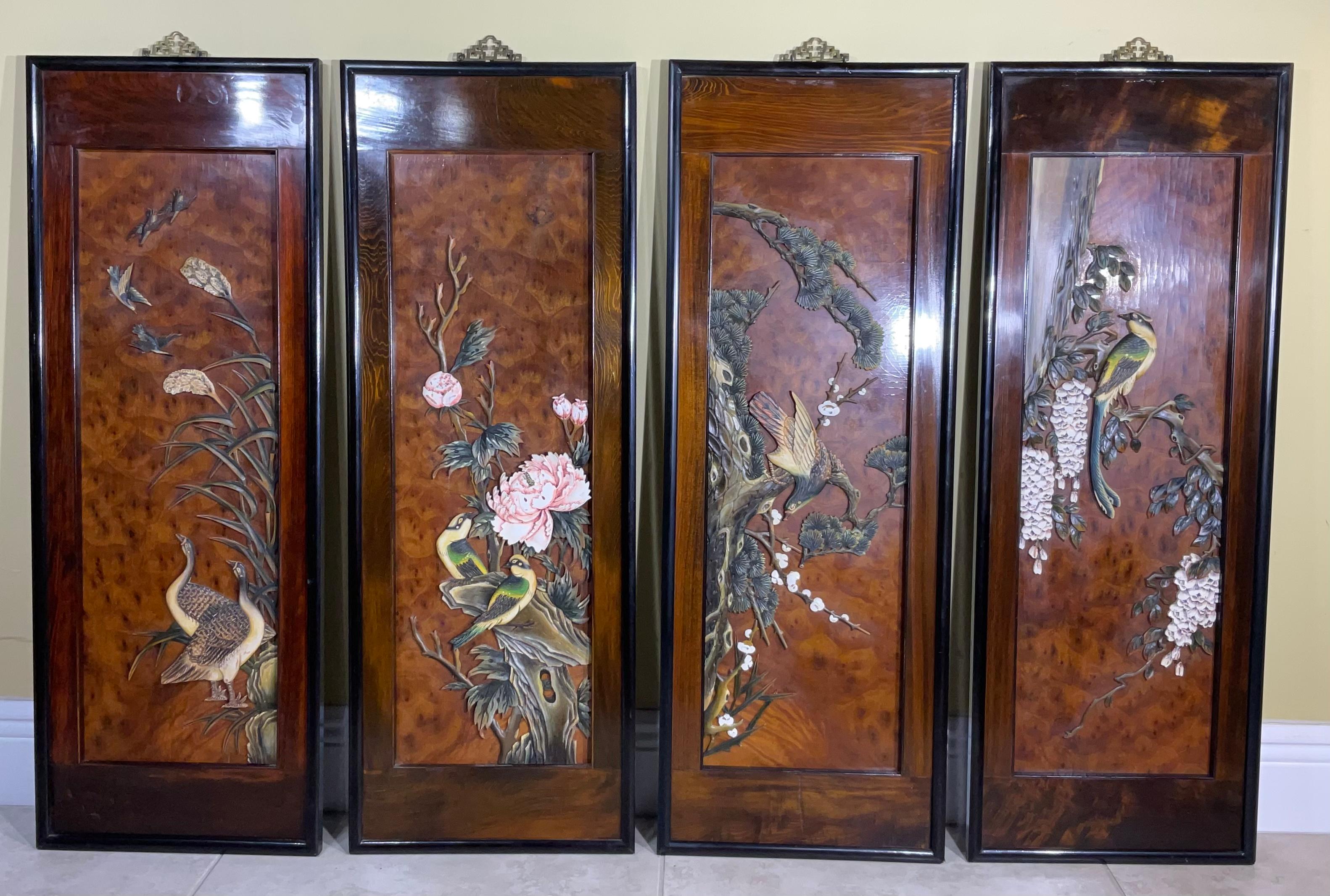 Post WWII, the wonderful set of 4 carved teak wood and framed wall panels still have the old paper labels that indicate they were made in Taiwan Republic of China. Each panel has different hand painted teak wood carvings that were mounted on
