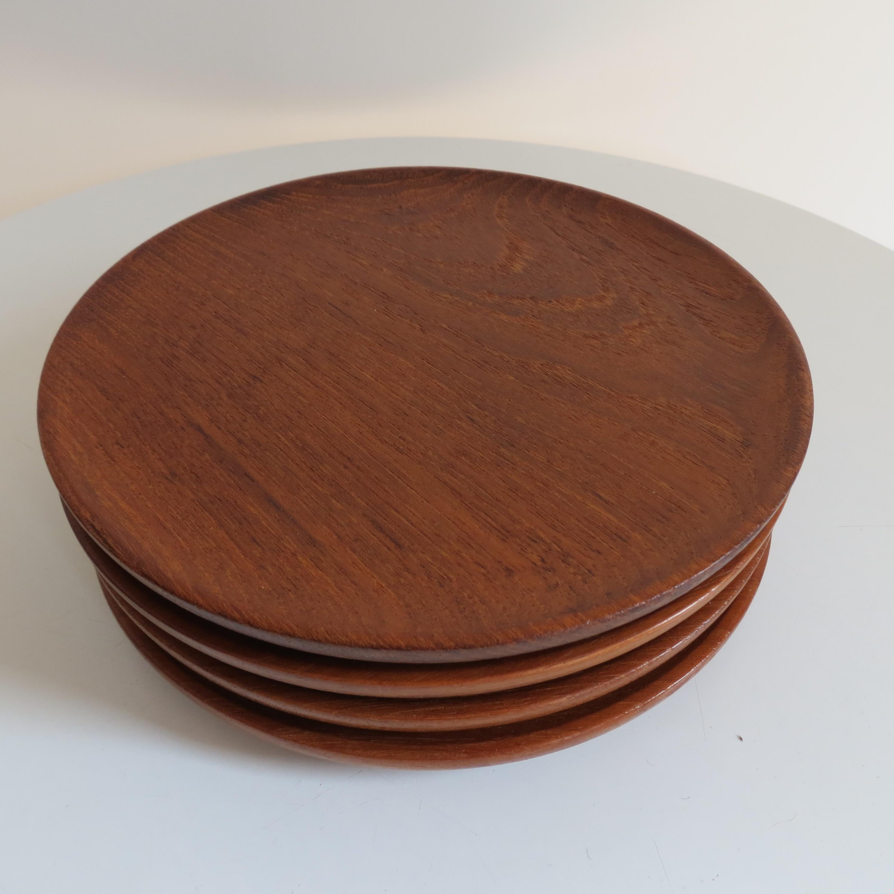 4 hand produced teak plates by Galatix England from the 1960s
Solid Burma teak.

Good vintage condition with minimal signs of wear. 
Each plate is stamped to the underside 
ST1208.