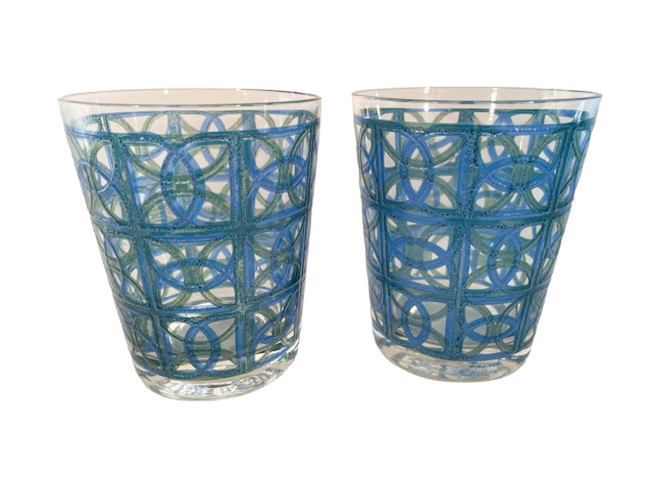 Set of four Mid-Century Modern double old fashioned glasses designed by Irene Pasinski for Washington Glass Co. in clear glass with raised and textured translucent green and blue overlapped circles and squares, creating a complex geometric pattern.