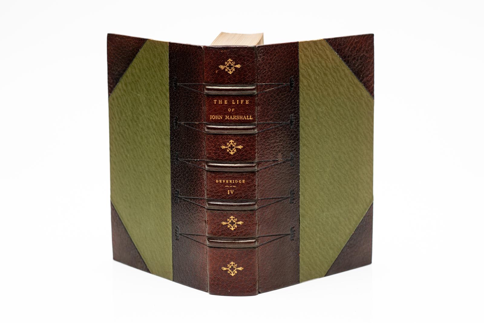 4 Vols. Albert J. Beveridge, The Life of John Marshall. First Edition. Bound in 3/4 brown morocco, silk boards, marbled endpapers, top edges gilt, raised bands, gilt panels. Published: Boston & New York, Houghton Mifflin Co. 1916.
H: 9