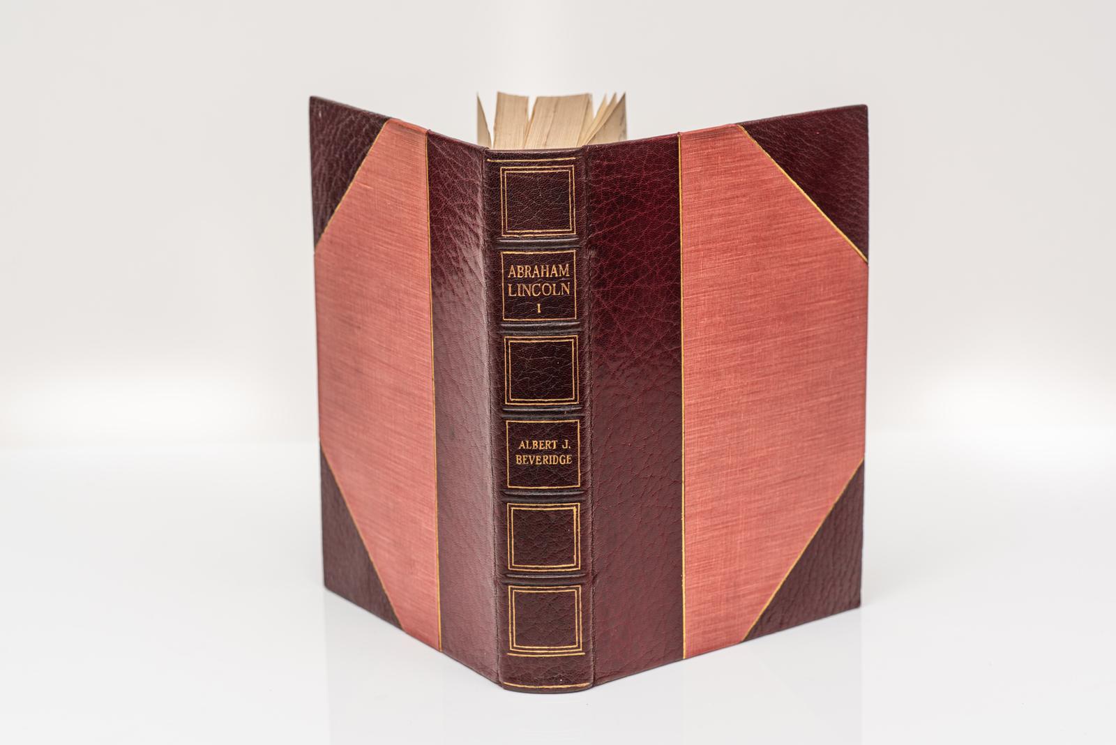 4 Volumes. Albert Beveridge, Abraham Lincoln (1809 - 1858). Bound in 3/4 red morocco with linen boards. Gilt-tooling on the covers and raised band spine. Top edges gilt. Portrait frontispiece and illustrated throughout with color plates. Limited to