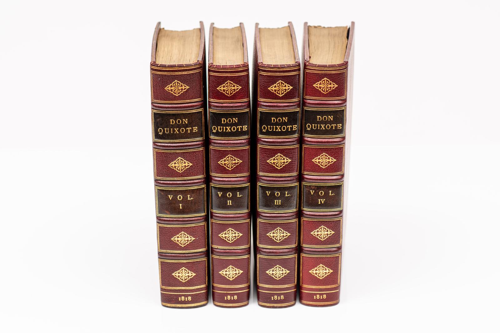 4 Volumes. Cervantes, Don Quichotte. Relié en plein maroquin rouge. Bords supérieurs dorés. Les couvertures sont dorées et les dos sont ornés de bandes en relief. Agrémenté de gravures d'après des tableaux peints par Robert Smirke. Londres : T.