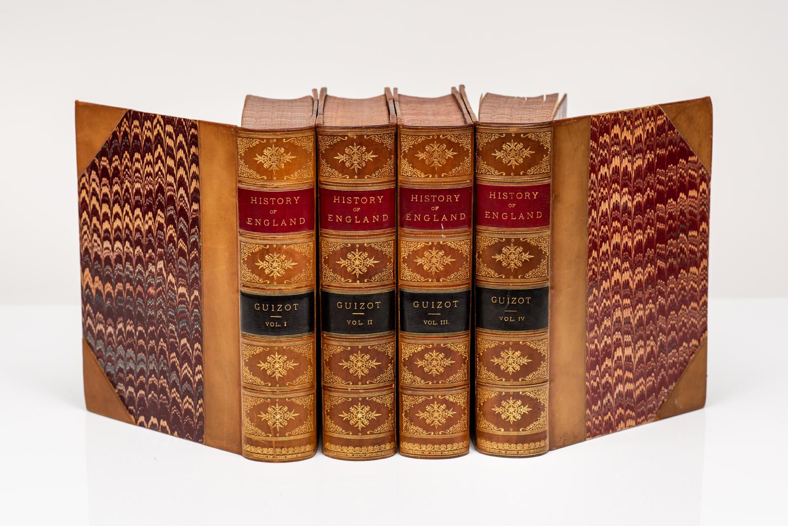 4 Volumes. Francois Pierre Guilaume Guizot, A Popular History of England from the Earliest Times to the Accession of Queen Victoria. Bound in 3/4 tan calf with marbled boards. Red and black labels on the spine. All edges marbled. Marbled endpapers.