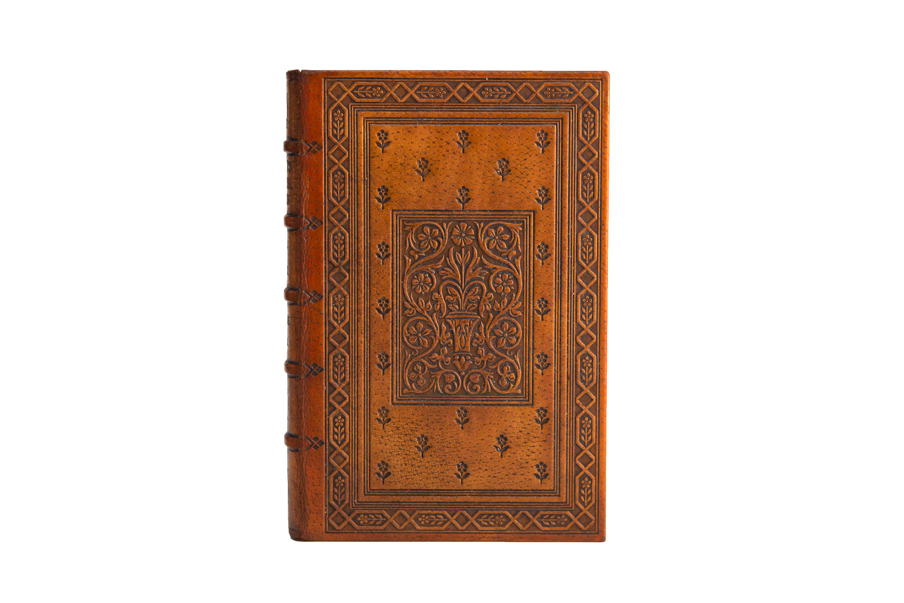4 Volumes. John Milton, The Poetical Works. Limited edition. Bound in full tan morocco with the covers displaying ornate floral open-tooled detailing and bordering. Raised bands with panels displaying open-tooled floral details and label lettering.
